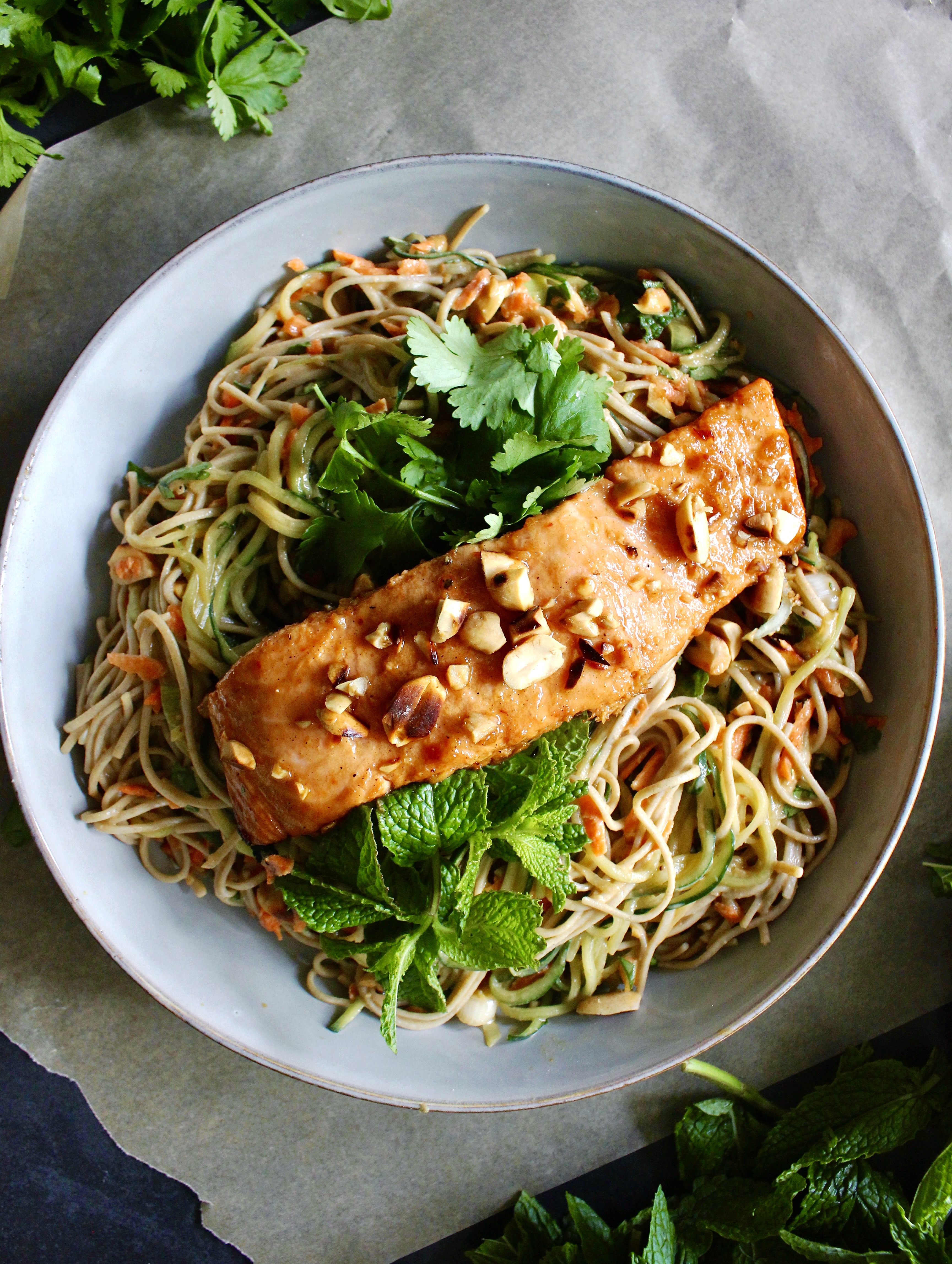 A blend of chilled soba and cucumber noodles tossed in an easy Asian ginger lime marinade all topped off with an easy seared salmon: this Chilled Salmon Cucumber and Soba Noodle Salmon Salad is the best!