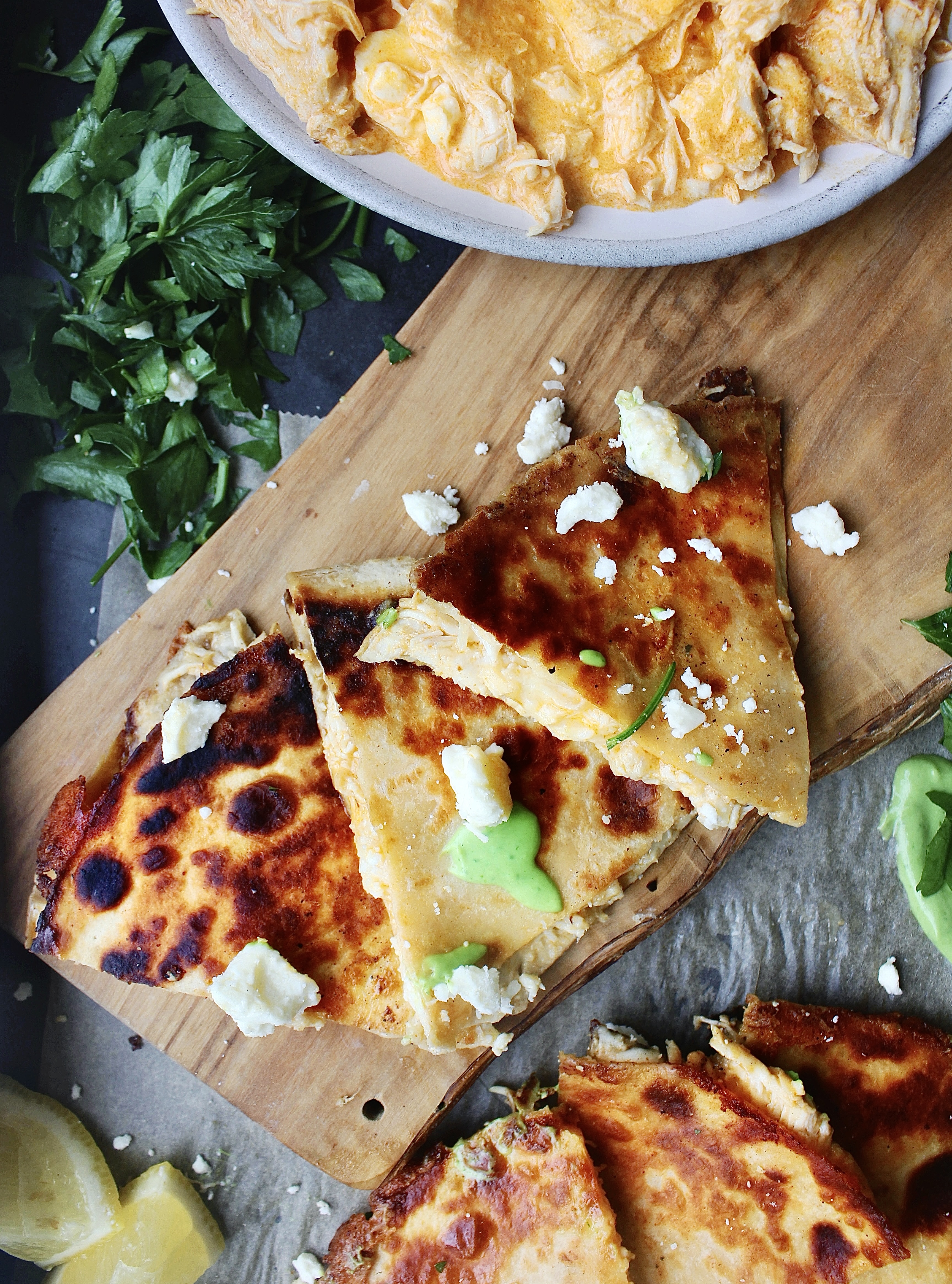 Saucy, creamy, and perfectly spiced, these Buffalo Chicken Quesadillas with Avocado Crema are packed with shredded buffalo chicken, all the cheese, and are dipped into a soothing avocado crema. There’s nothing better!!