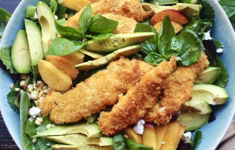 With a simple crusted chicken, all the best summer produce, a light and refreshing vinaigrette, and tons of creamy and crunchy textures, this Crispy Baked Chicken Salad with Corn, Peaches, and Basil is going to be your new favorite summer salad!