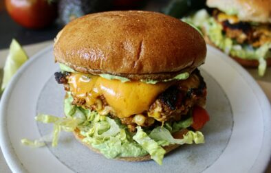 Peppers, corn, and onions sauteed in tons of spices and folded into the juiciest, chicken patties: these Fiesta Corn Cheddar Chicken Burgers with Avocado Sauce are next level amazing.