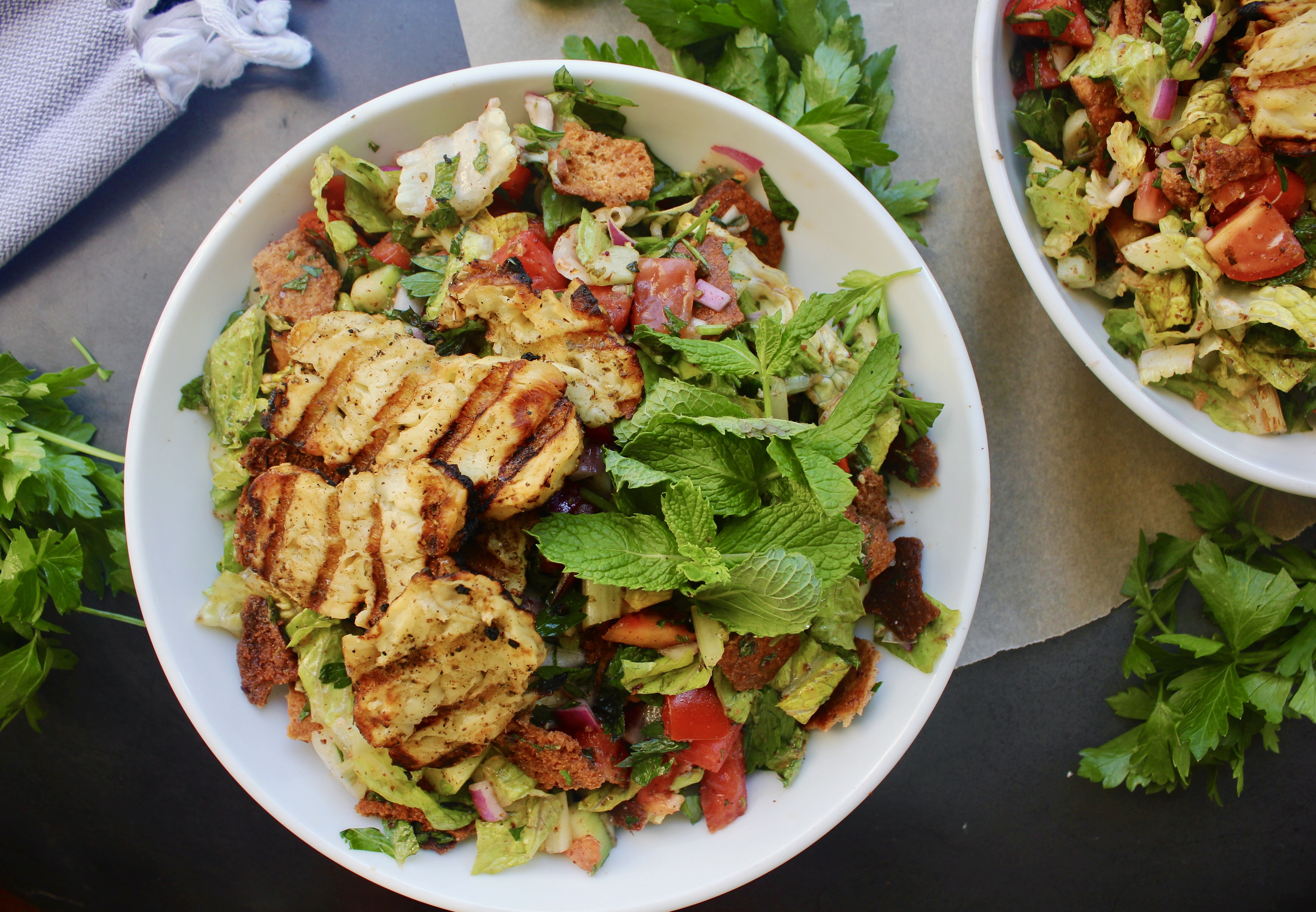 With crispy pita chips, perfectly charred halloumi cheese, and the best Greek fixins, this Charred Halloumi Fattoush Salad with Homemade Pita Chips is everything!!