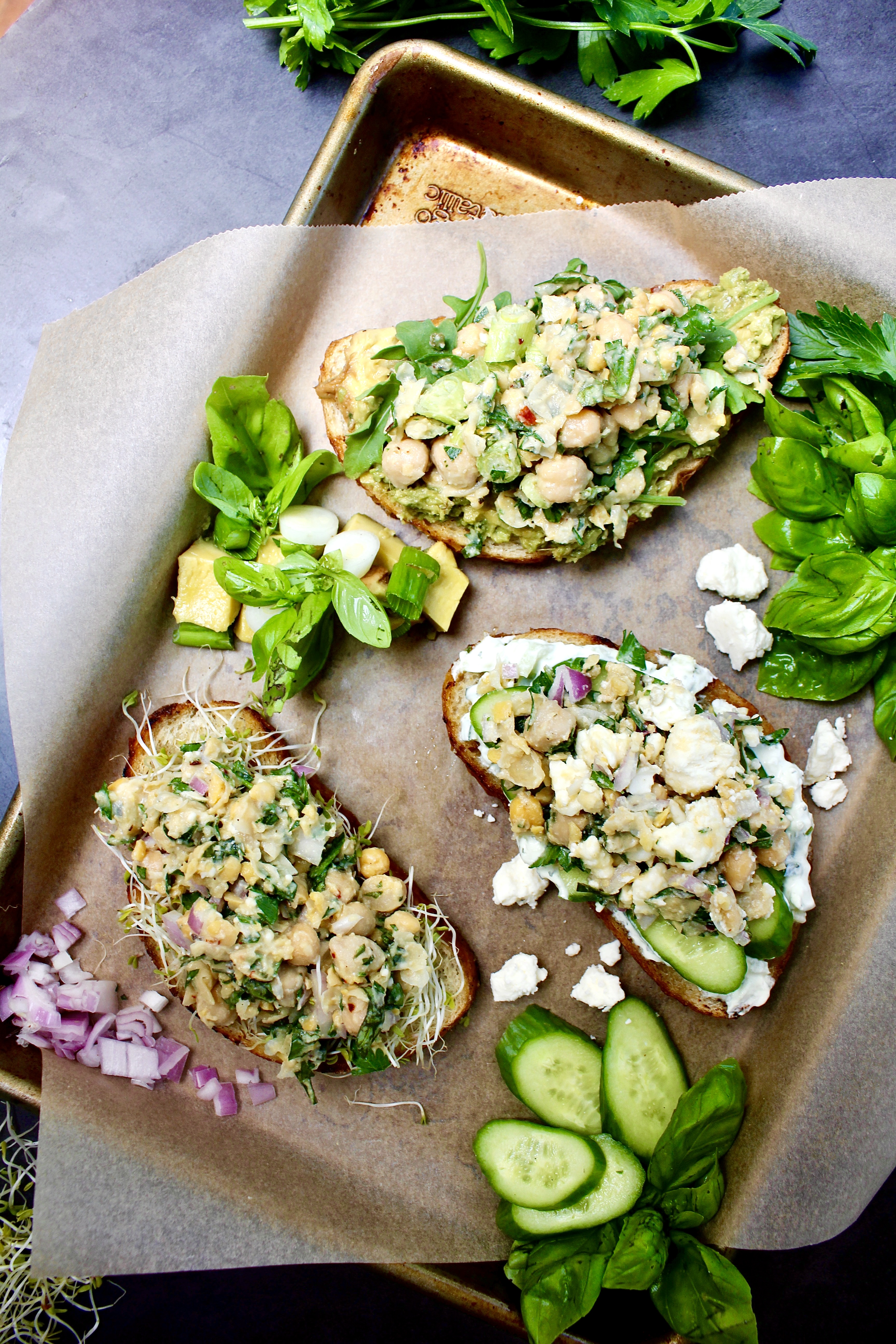 With a delicious base of mashed chickpeas, fresh herbs, and all the flavors, these Lemon Herb Chickpea Salad Tartines Three Ways take your traditional toast above and beyond!