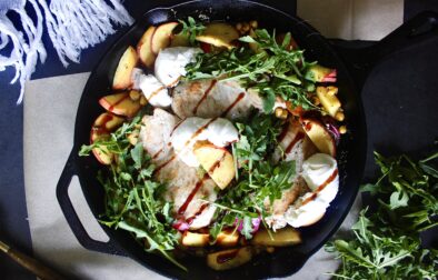 Peaches, corn, and chicken baked in luscious balsamic citrus juices all finished off with fresh arugula and creamy burrata cheese: this Summer Balsamic Chicken Skillet with Creamy Burrata is the best skillet meal!