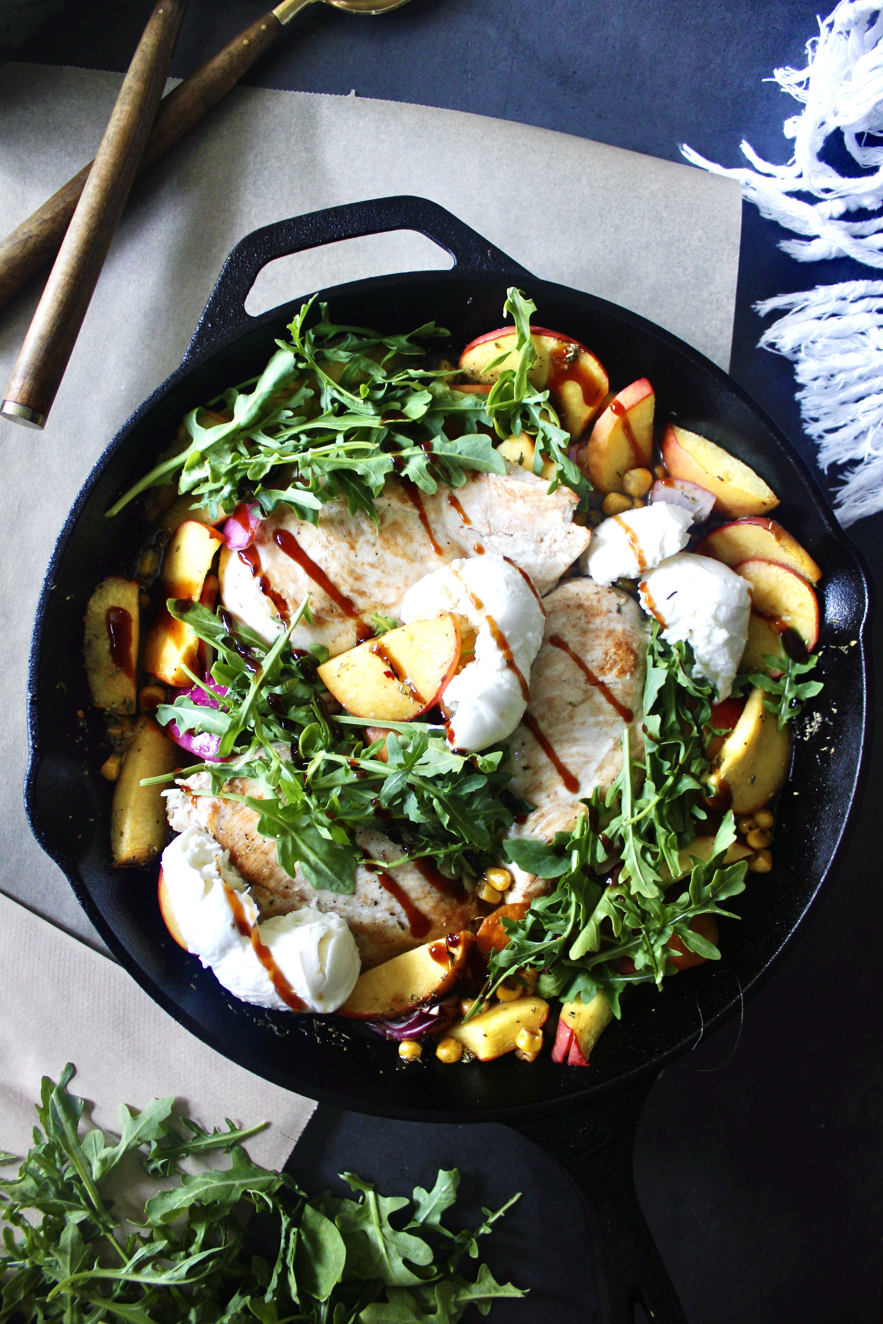  Peaches, corn, and chicken baked in luscious balsamic citrus juices all finished off with fresh arugula and creamy burrata cheese: this Summer Balsamic Chicken Skillet with Creamy Burrata is the best skillet meal!