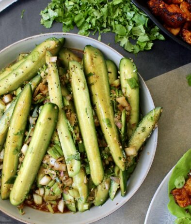 Crunchy persian cucumbers, shallots, and scallions marinated tossed with a simple sweet and tangy Asian vinaigrette with crispy sesame seeds: this Marinated Asian Cucumber Scallion Salad truly hits all the marks!