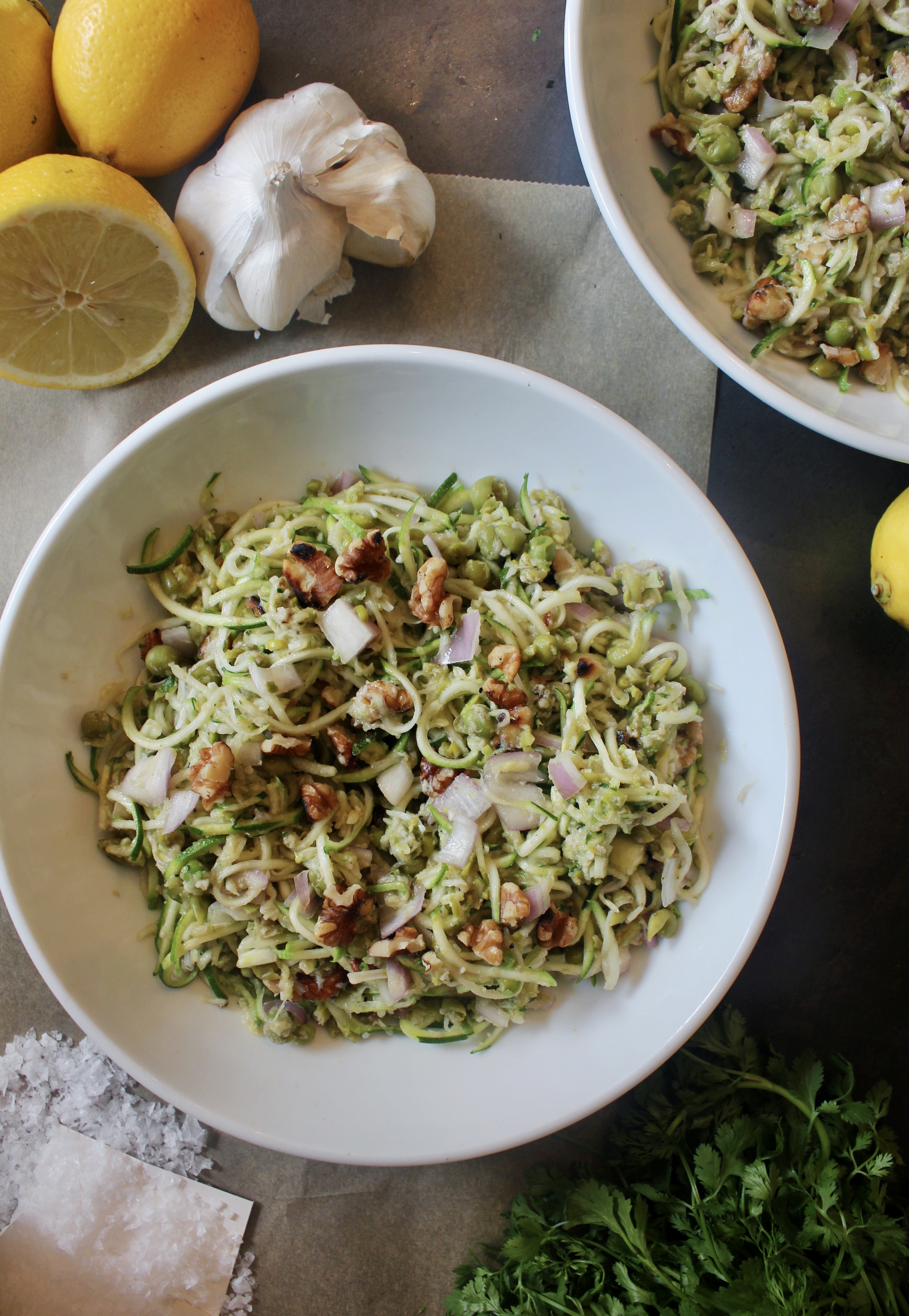 Zucchini two ways tossed with crunchy walnuts and shallots and mixed in with creamy parmesan mashed peas: this Parmesan Zucchini and Mashed Pea Salad is light, luscious, and extremely addicting. 