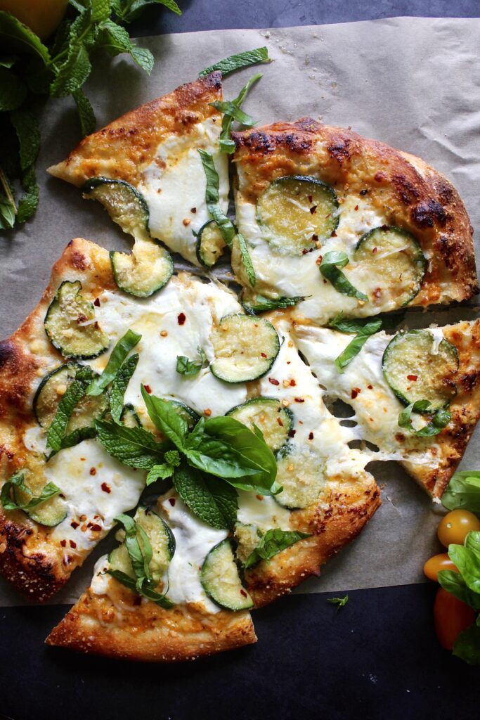  Fresh mozzarella and pecorino melted over a homemade yellow tomato sauce and finished off with crispy summer zucchini: this Pecorino Crusted Yellow Pizza with Crispy Zucchini is truly the best summer pizza.