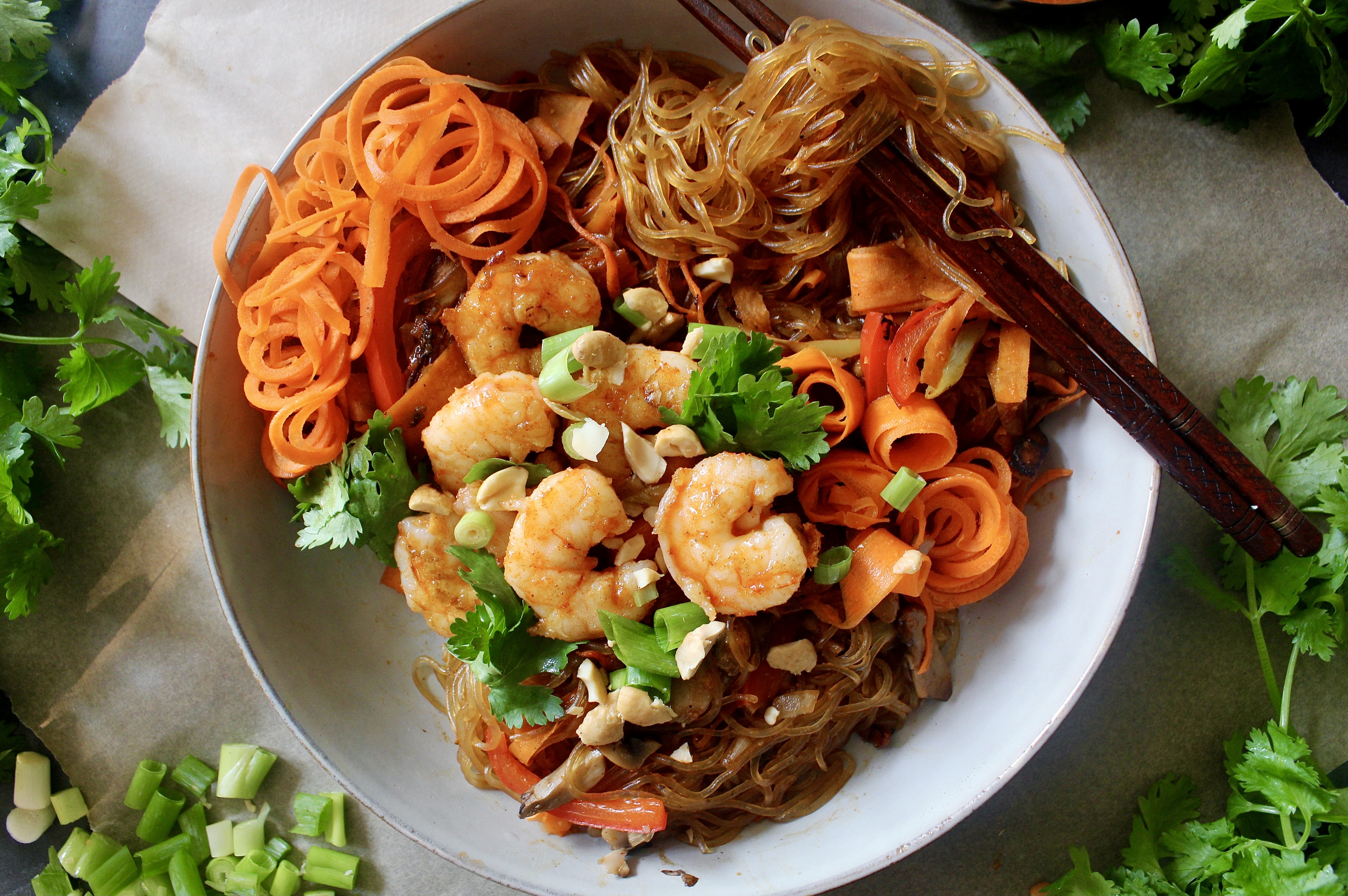 Wok seared shrimp tossed in saucy glass noodles with all the veggies: this Korean Glass Noodle Shrimp Stir Fry is the best easy weeknight dinner!