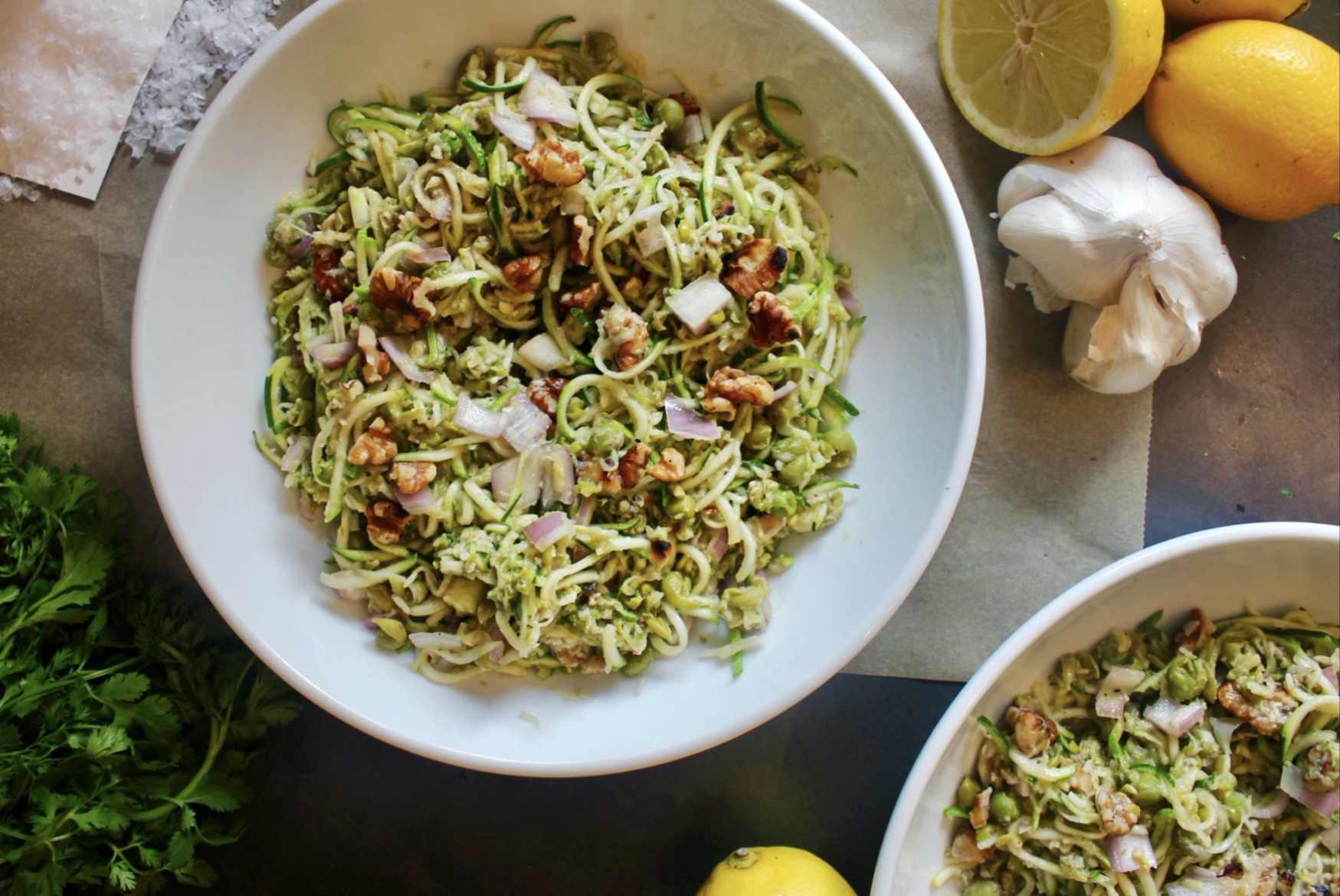 Zucchini two ways tossed with crunchy walnuts and shallots and mixed in with creamy parmesan mashed peas: this Parmesan Zucchini and Mashed Pea Salad is light, luscious, and extremely addicting.