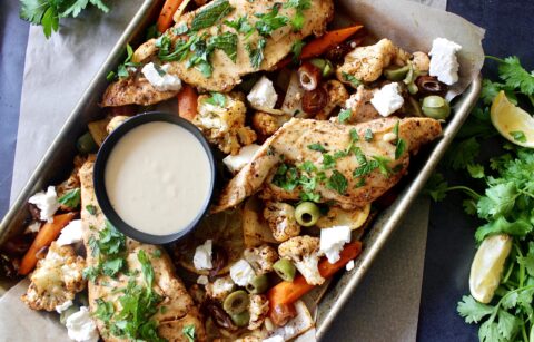 Juicy roasted chicken, carrots, and onions tossed with spices, feta, dates, and olives: this Sheet Pan Moroccan Chicken and Vegetables is the best, quick dinner!