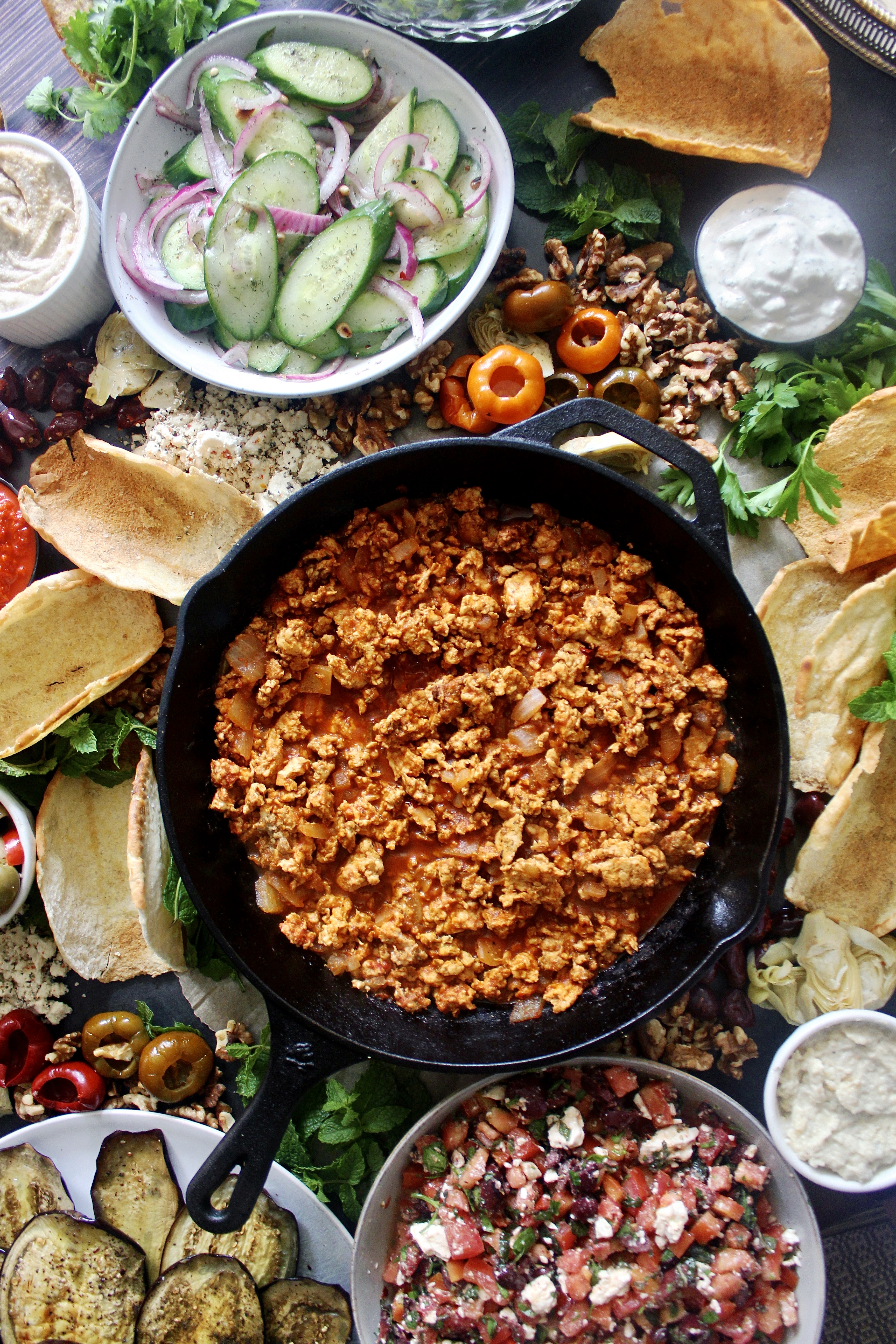 Crispy homemade pita shells, saucy spiced lamb, and an assortment of toppings of your choosing: this Mezze Board Spiced Lamb Taco Bar is the ultimate party spread.