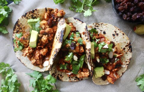 Sweet, spicy, tangy, and salty: these Saucy Cuban Picadillo Tofu and Cauliflower Tacos are stuffed to the brim with the best vegetarian take on the classic dish!