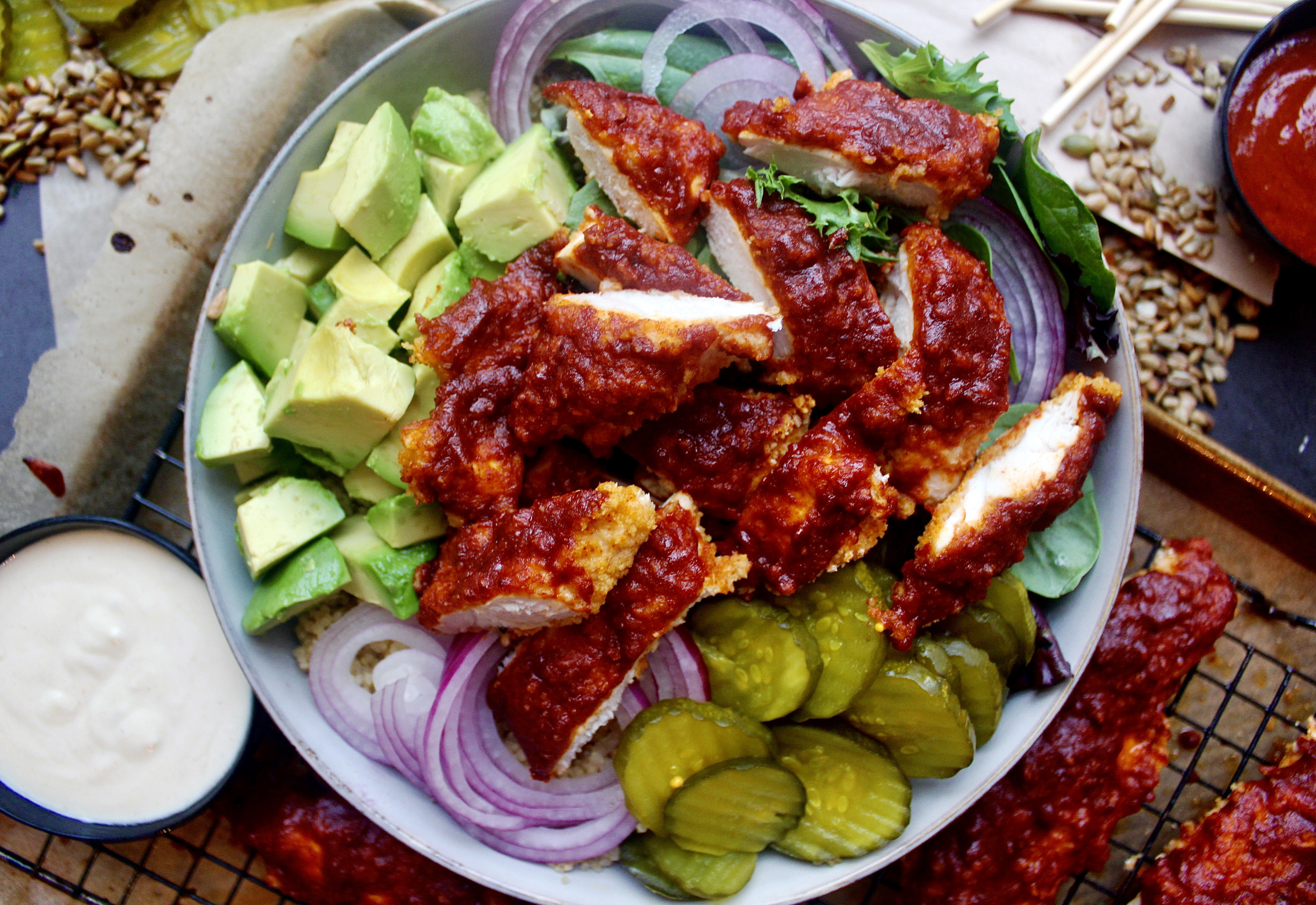 A lighter take on the classic crispy southern chicken all chopped up in a bowl with your fav sweet and spicy toppings: these Healthier Nashville Hot Chicken Bowls are my everything!!