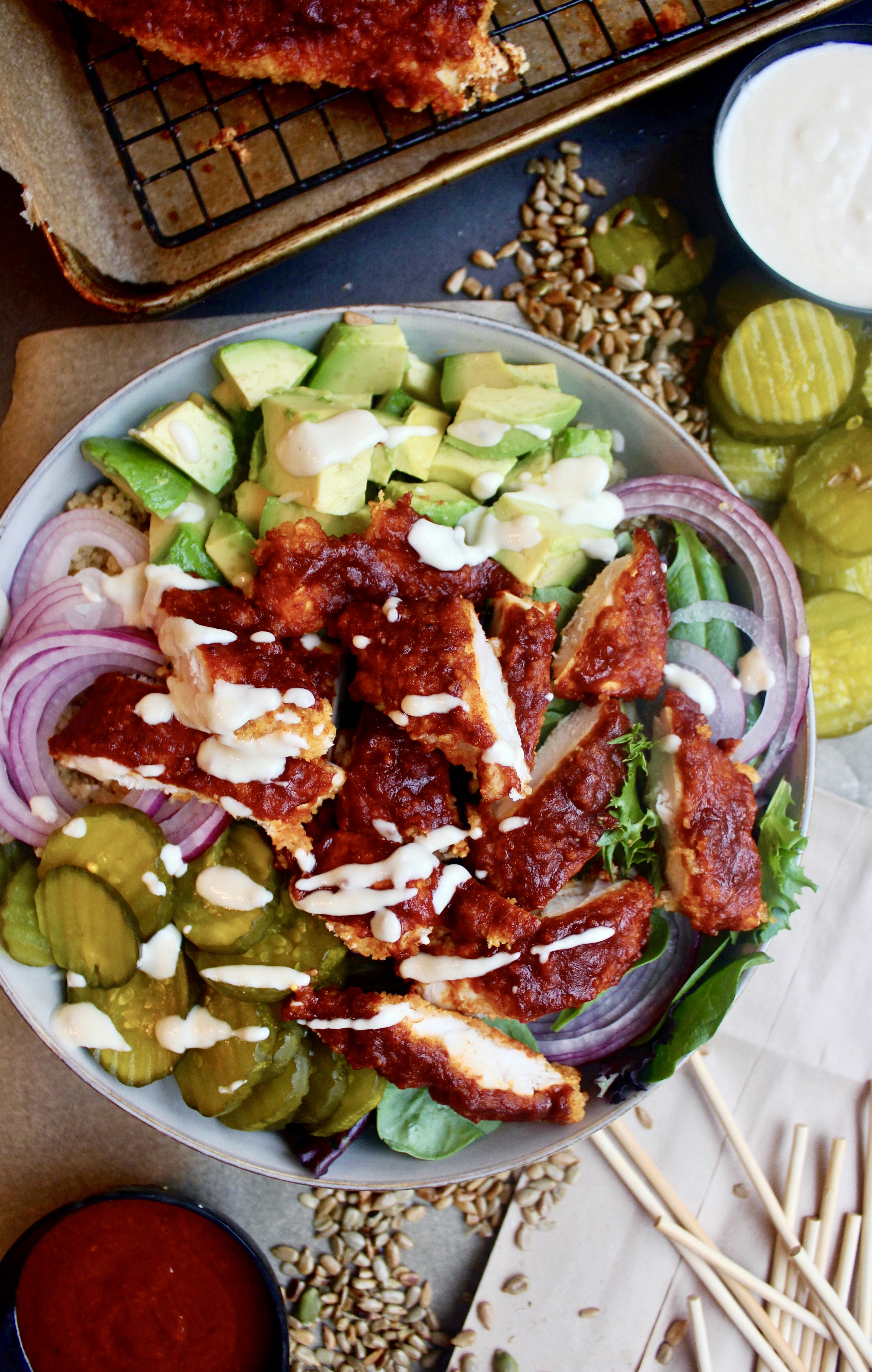 A lighter take on the classic crispy southern chicken all chopped up in a bowl with your fav sweet and spicy  toppings: these Healthier Nashville Hot Chicken Bowls are my everything!!