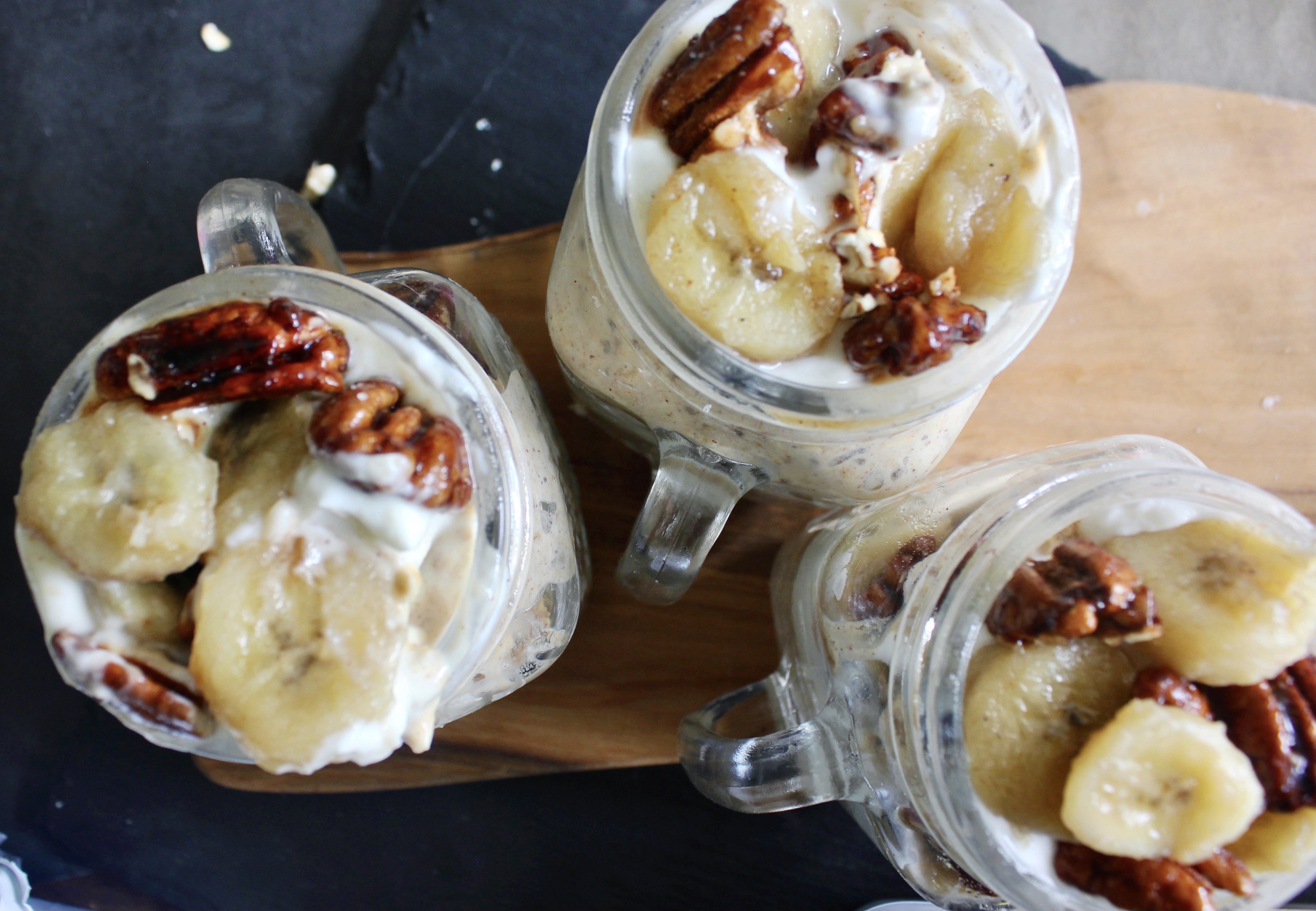 Creamy maple overnight chia oats layered with caramelized bananas and homemade candied pecans: these Banana Maple Pecan Overnight Oat Chia Parfaits are the ultimate breakfast.