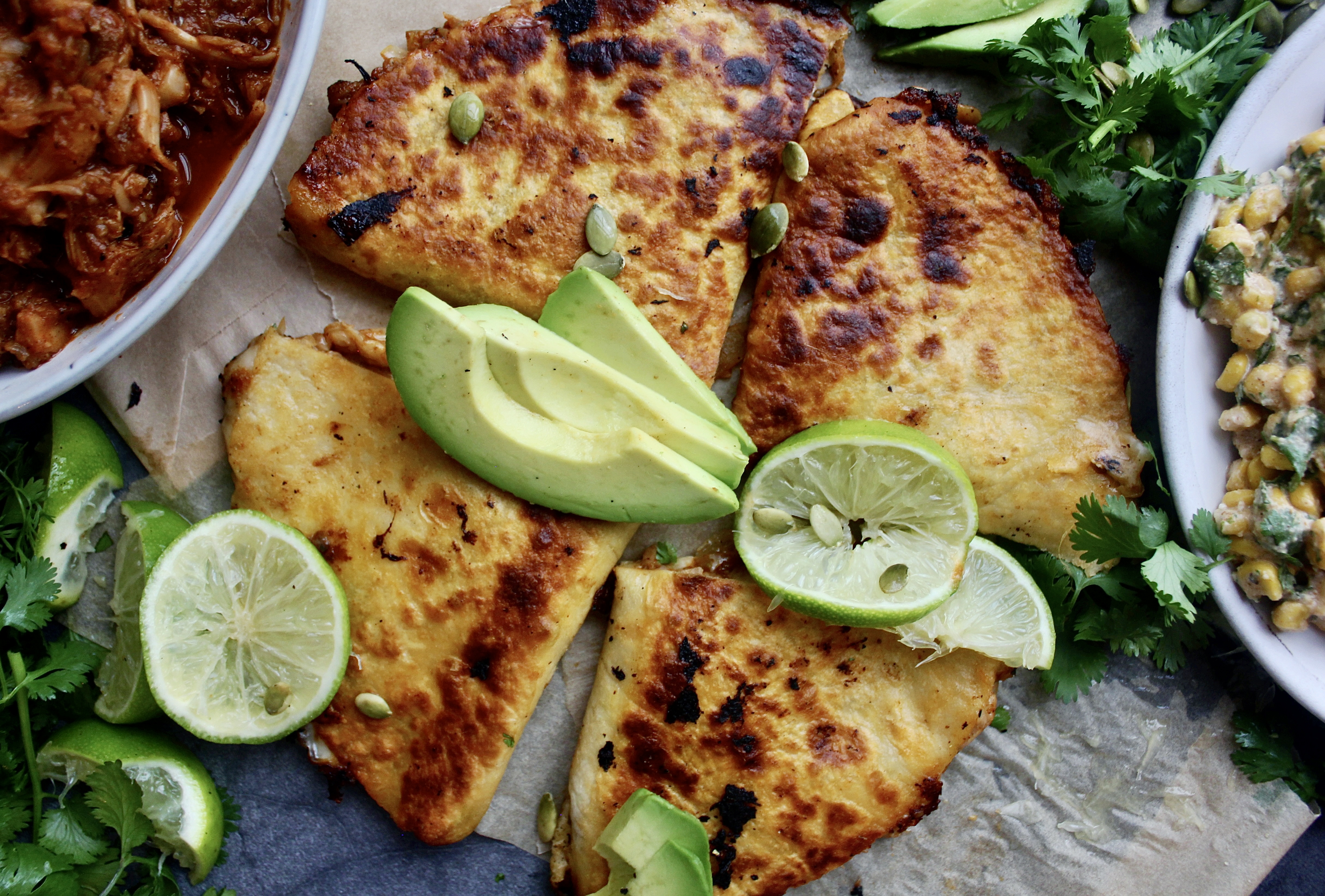 Smoky, juicy pulled jackfruit carnitas tucked into a cheesy tortilla served with avocado and my Super Simple Mexican Corn Dip: these Jackfruit Carnitas Quesadillas with Mexican Corn Dip are the ultimate healthy vegetarian munchie.