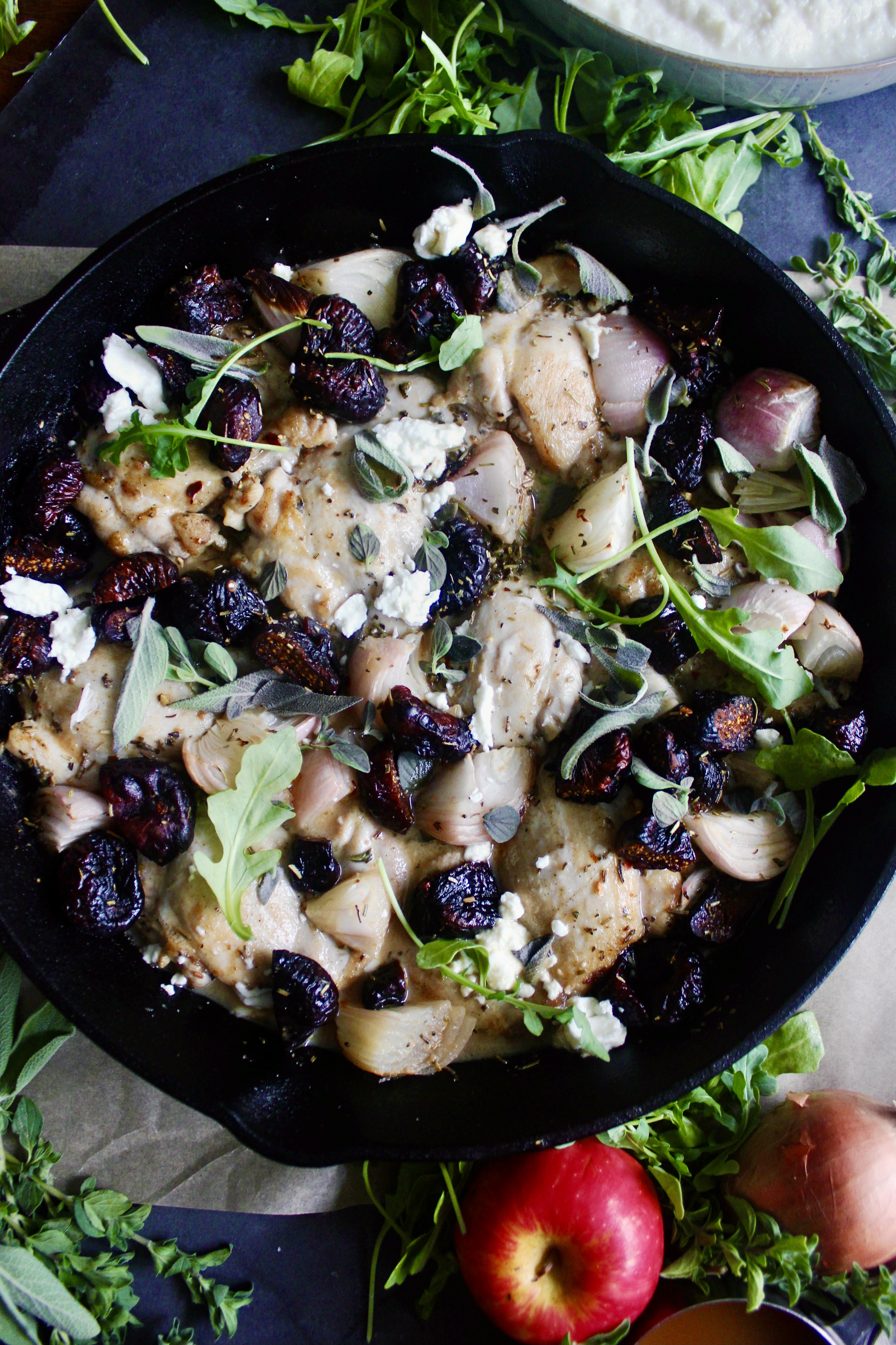 Crispy seared chicken thighs, figs, and shallots baked in a herbaceous dijon honey apple cider and topped off with creamy goat cheese and a balsamic glaze: this Cast Iron Apple Cider Chicken and Figs is the easiest, warming meal.