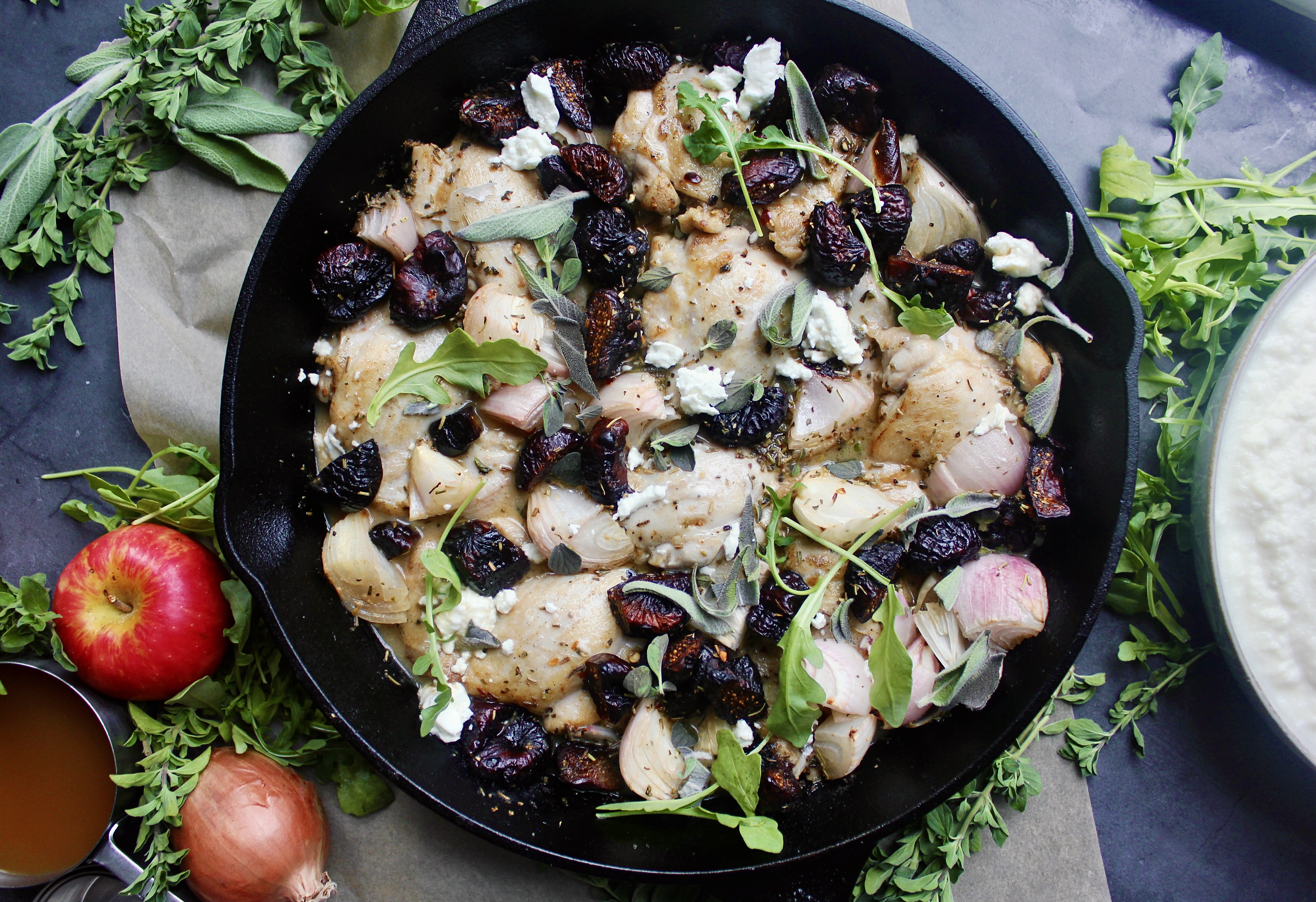 Crispy seared chicken thighs, figs, and shallots baked in a herbaceous dijon honey apple cider and topped off with creamy goat cheese and a balsamic glaze: this Cast Iron Apple Cider Chicken and Figs is the easiest, warming meal.