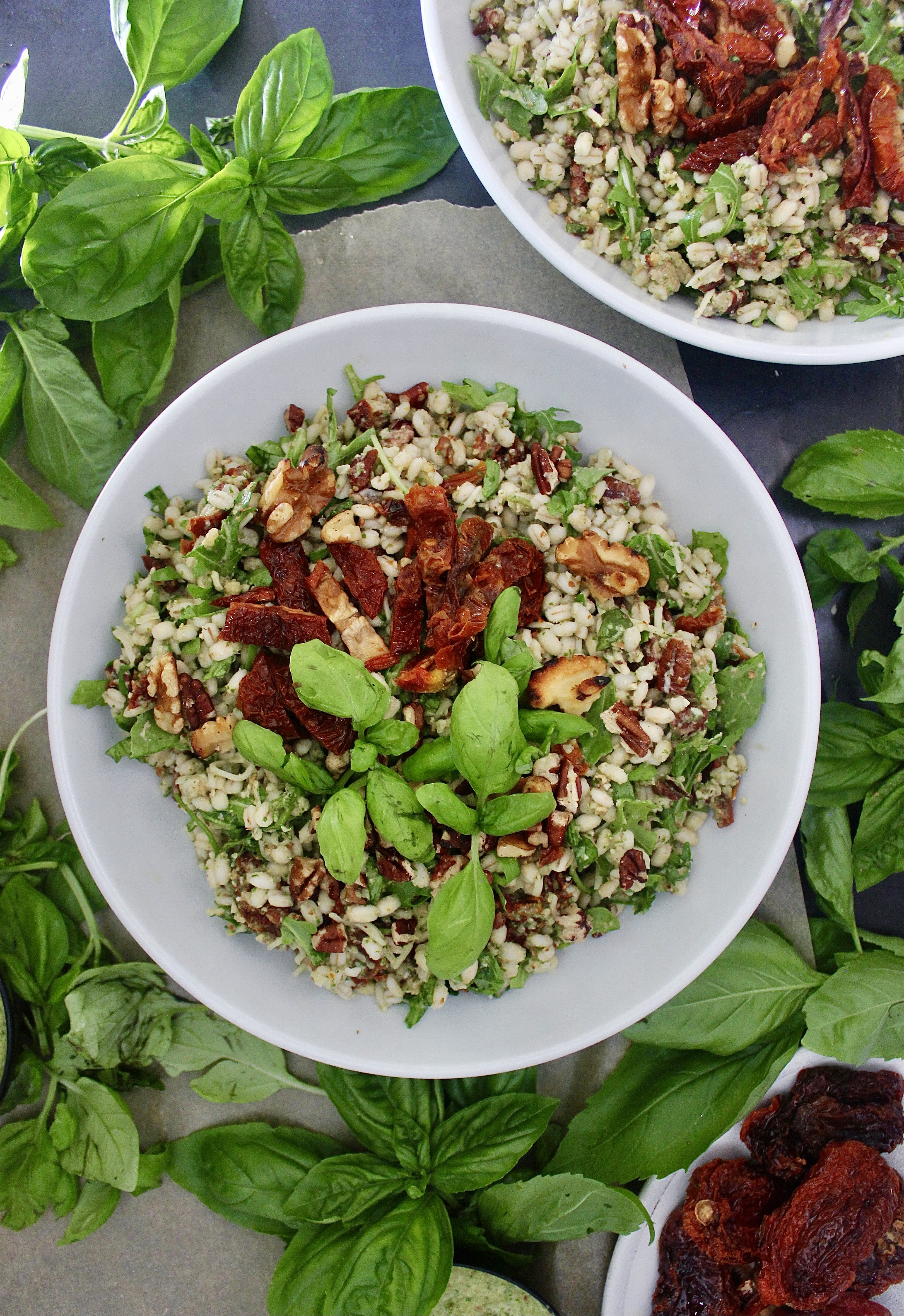 The easy, nutrient-packed, and oh-so flavorful bulgur salad loaded with parmesan, arugula, and walnuts: this Basil Pesto and Sun Dried Tomato Bulgur Salad is one of my go-to recipes!!