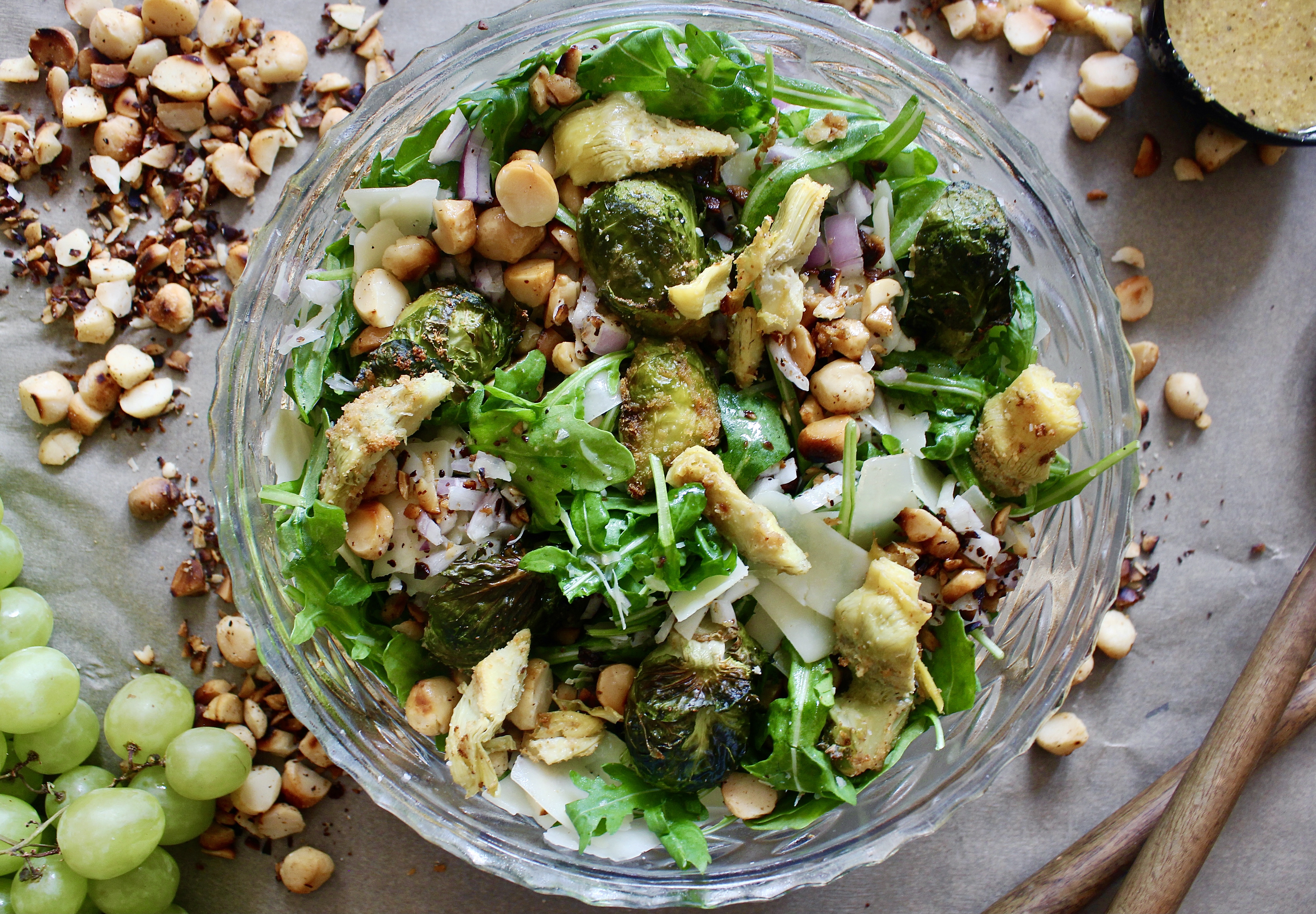 Garlicky charred artichokes and brussels with fresh arugula, parm, and all the crispy crunchy bits tossd in a maple dijon vinaigrette: this Maple Dijon Crispy Artichoke and Brussels Sprouts Salad is the best way to get in those autumn veggies!