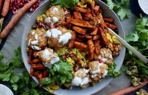 Spiced turmeric saffron rice with super simple Moroccan flavored meatballs topped with a creamy lemon yogurt sauce and tangy pomegranate seeds: these Super Simple Golden Rice and Moroccan Meatball Bowls are the best weeknight dinner!