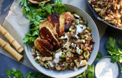 Caramelized garlic onion and cauliflower toss up with an olive and herbed quinoa finished off with some pan fried halloumi cheese and a greek yogurt drizzle: these Charred Halloumi Mediterranean Red Quinoa Bowls are the most epic meatless dinner!