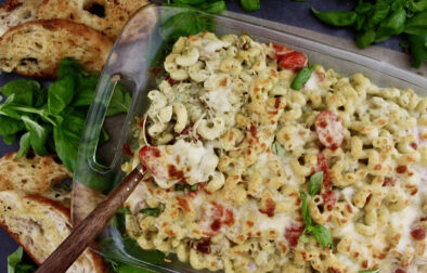 With a base of a creamy pesto cheese sauce, your favorite short cut pasta, and a crispy cheesy top: this Healthier Cheesy Chicken Pesto Pasta Bake is an all time favorite comfort food!