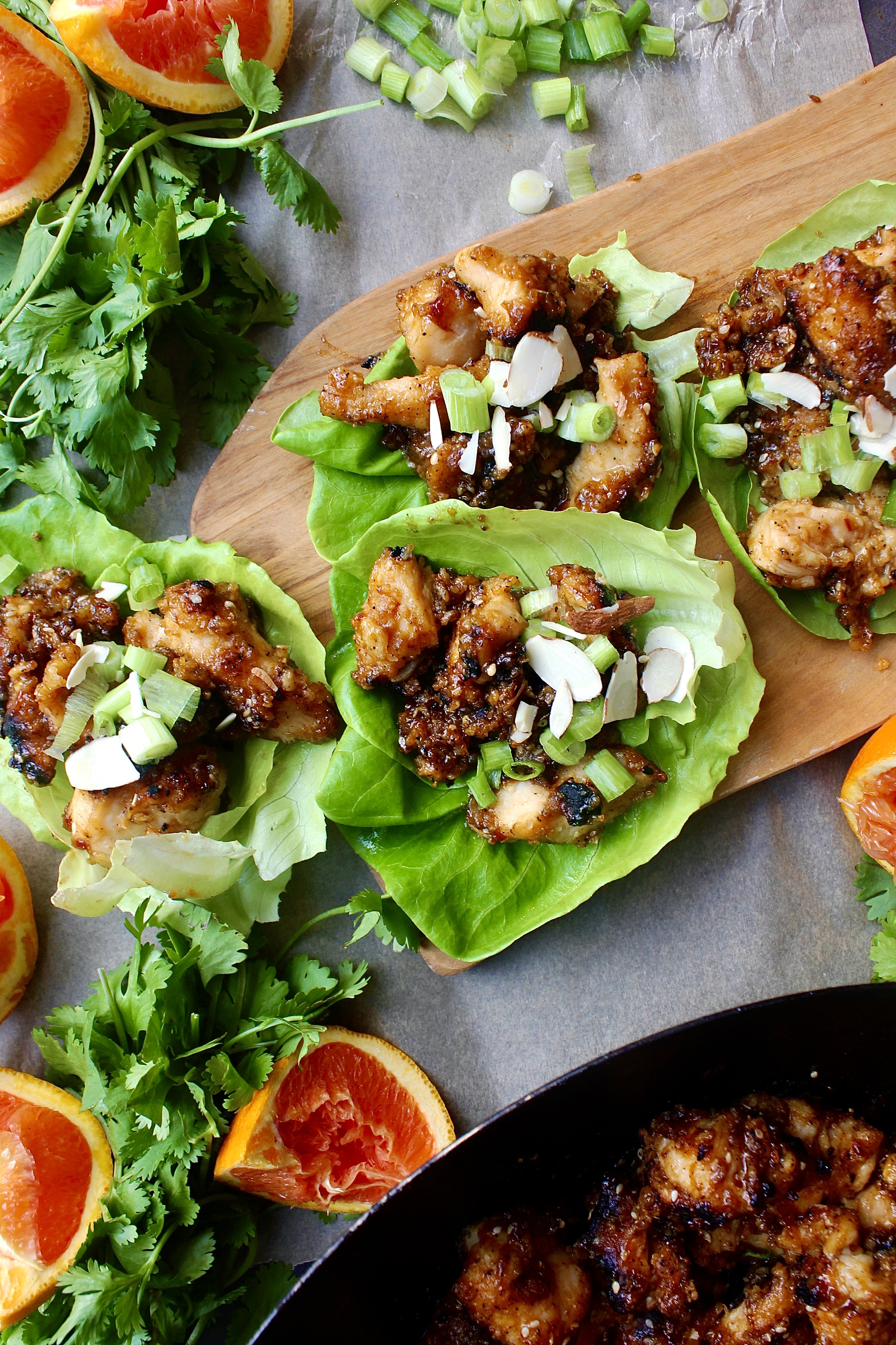 Crispy, crunchy, and super saucy orange sesame chicken folded up into a lettuce wrap with all the textures: these Chinese Orange Chicken Lettuce Wraps are seriously better than takeout!!