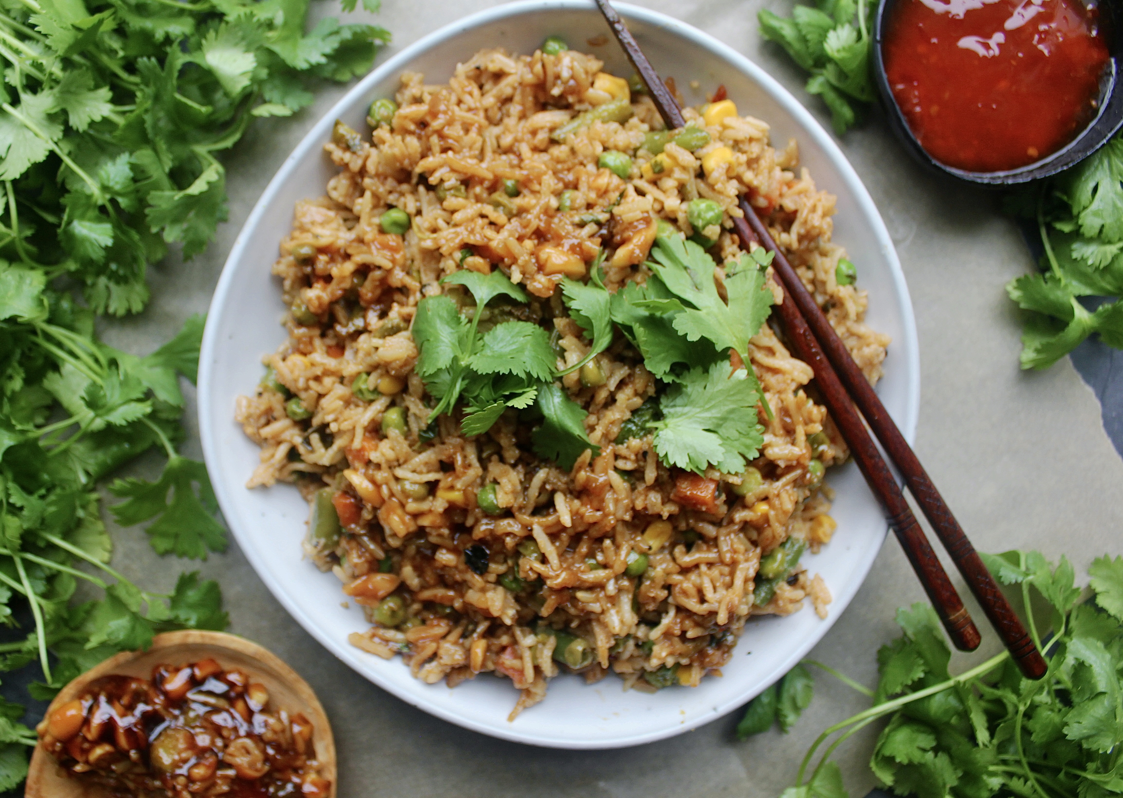 Tons of stir fried veggies, all the good Asian sauces, and extremely garlicky caramelized onions all mixed up in your favorite rice: My Everyday Healthier Fried Rice is truly the Asian side I make every week.