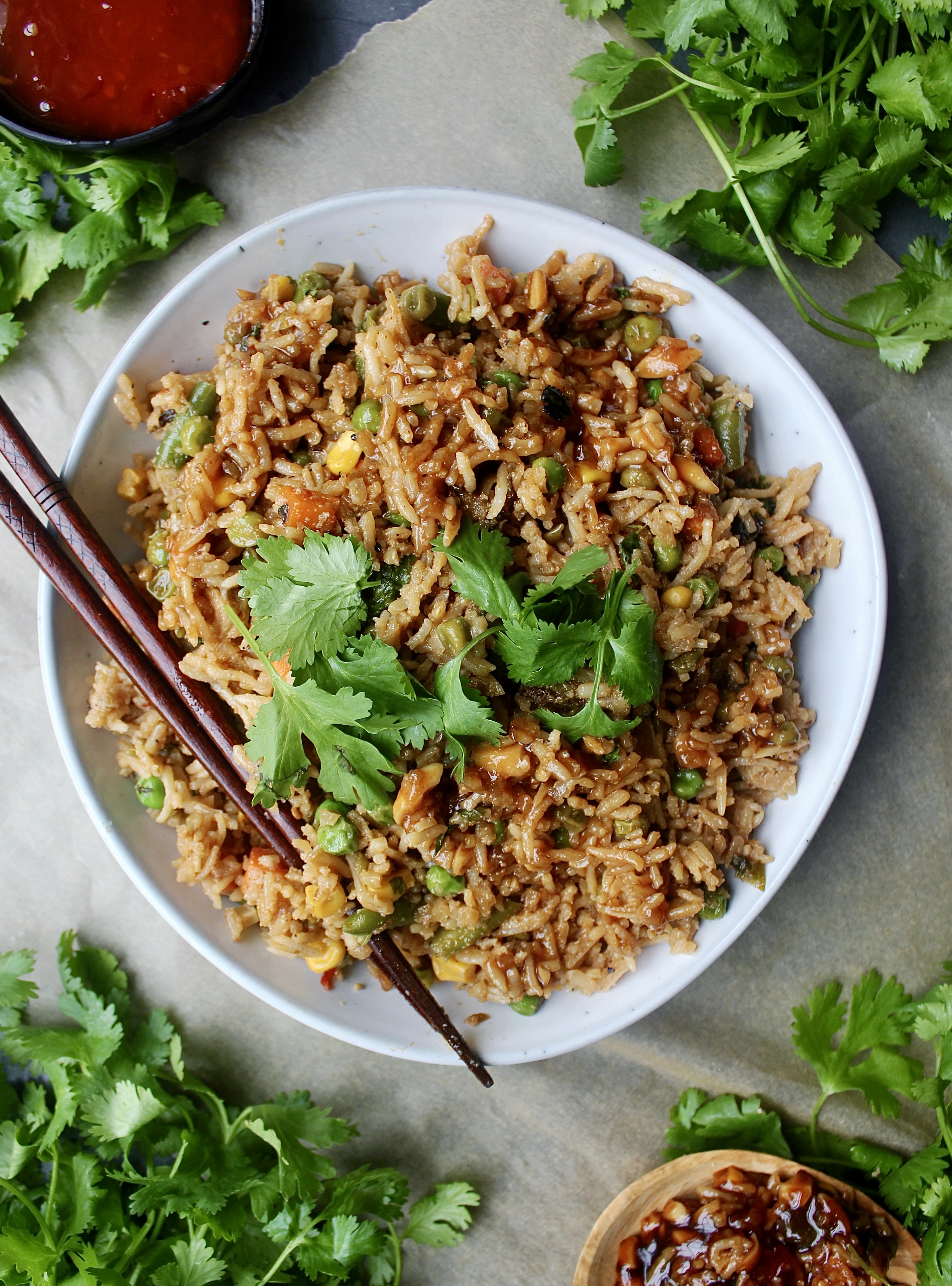 Tons of stir fried veggies, all the good Asian sauces, and extremely garlicky caramelized onions all mixed up in your favorite rice: My Everyday Healthier Fried Rice is truly the Asian side I make every week.