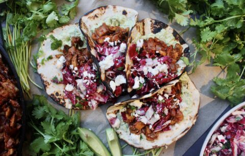 Caramelized, Mexican spiced mushrooms layered over a creamy mashed avocado crema and finished with a tart cotija cilantro slaw: these Caramelized Shiitake Tacos with Cotija Cilantro Slaw are the ultimate vegetarian taco!