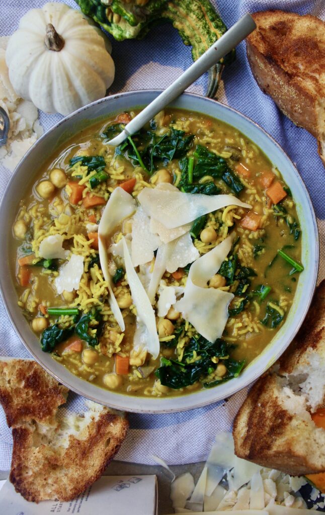 Warming, ginger and turmeric spiced veggies mixed into a healthy creamy broth fluffed up with flaky basmati rice: this Turmeric Immunity Chickpea and Rice Soup is my favorite cozy meal!