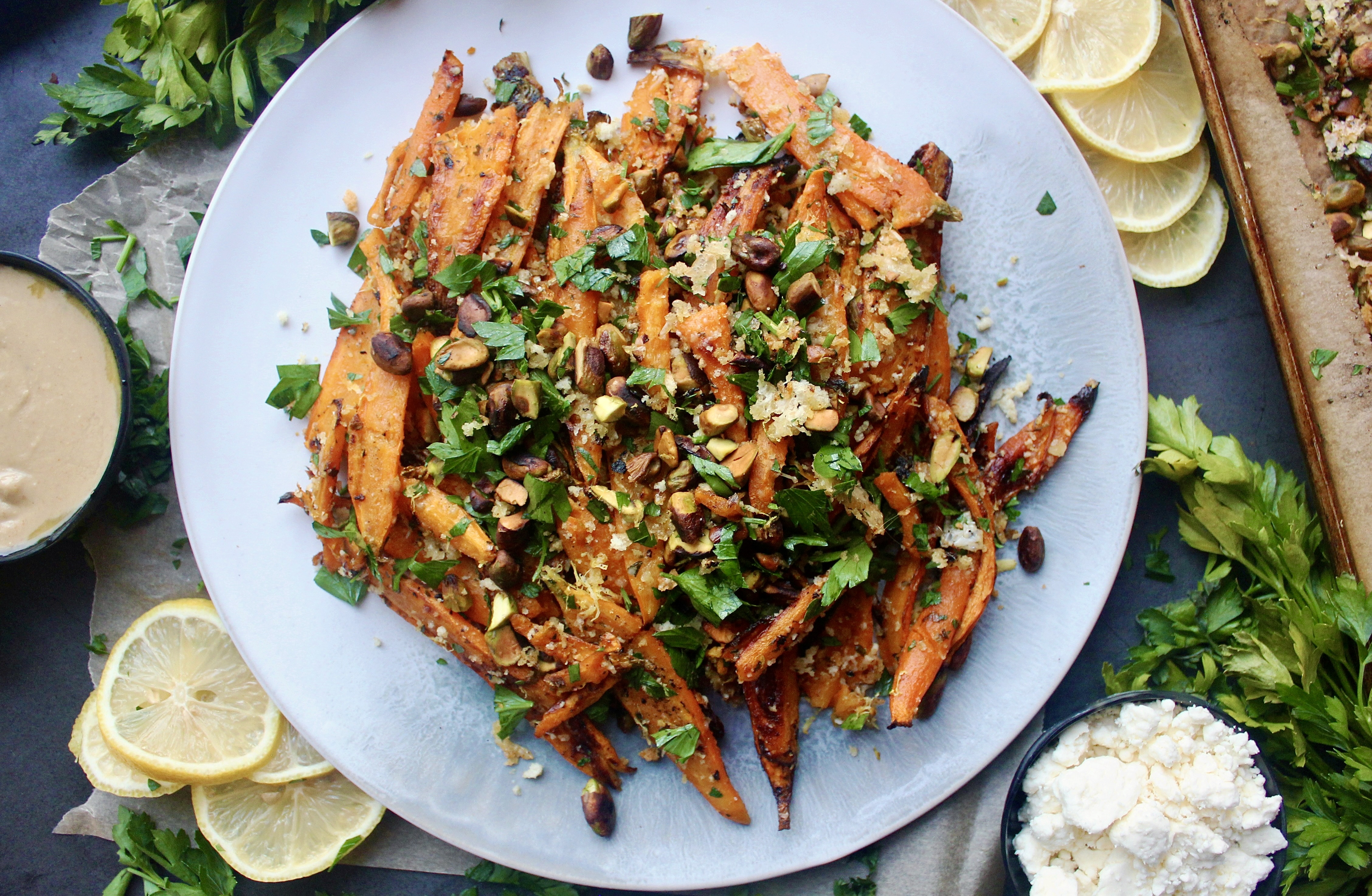 Twice baked, crispy cheese smashed carrots tossed with all the parmesan cheese, fresh parsley, and toasty pistachios: these Parmesan Pistachio Smashed Carrots are the best vegetable side dish. #onanniesmenu #delish #eathealthy #healthyrecipes #eatrealfood #easydinner #easymeal #foodporn #healthyish #eatwellbewell #realfoodz #wholefoodie #glutenfree #familydinner #goodeats #fuel #paleo #healthyfoods #foodblog #foodcoma #comfortfood #weeknightdinner