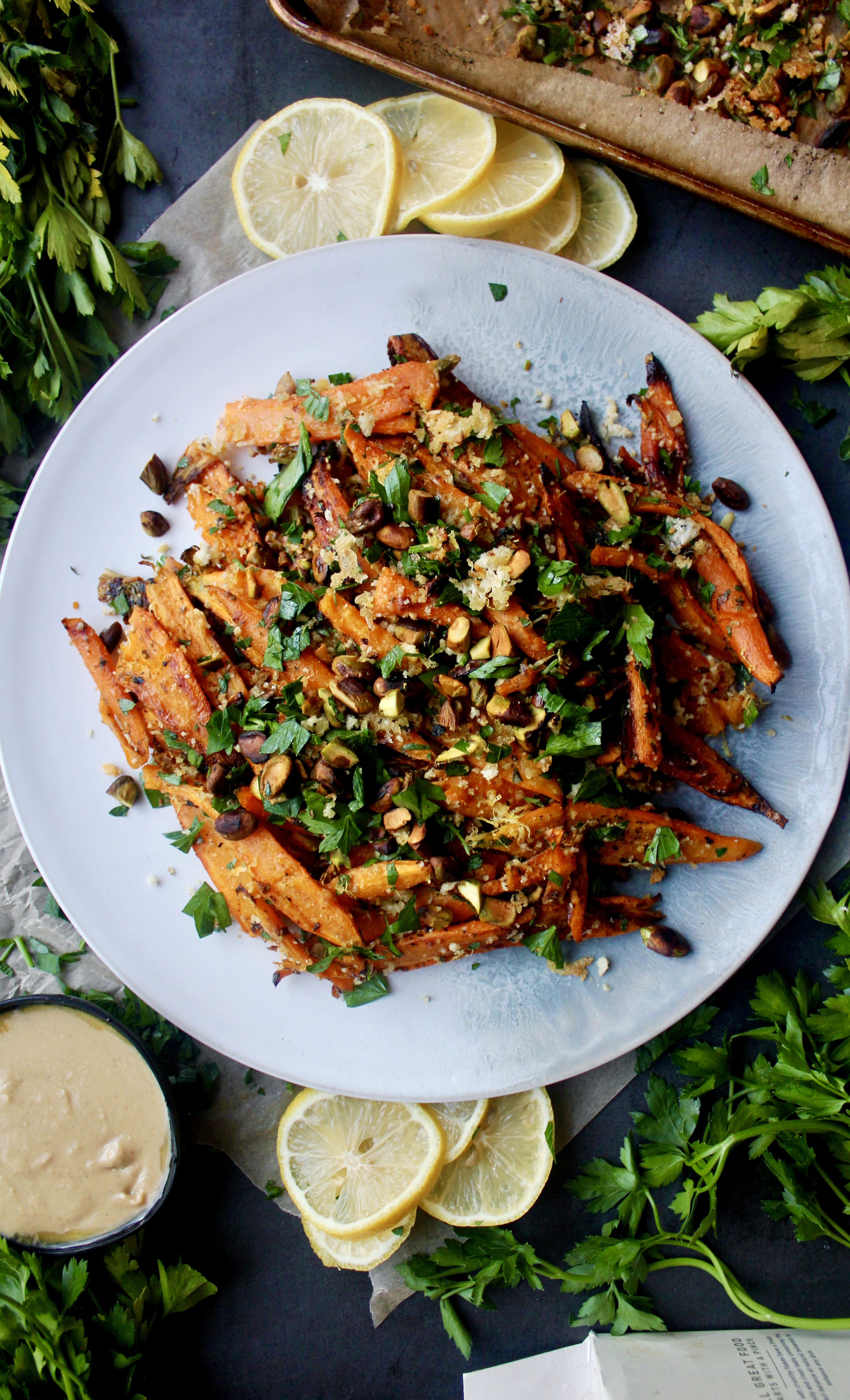 Twice baked, crispy cheese smashed carrots tossed with all the parmesan cheese, fresh parsley, and toasty pistachios: these Parmesan Pistachio Smashed Carrots are the best vegetable side dish.