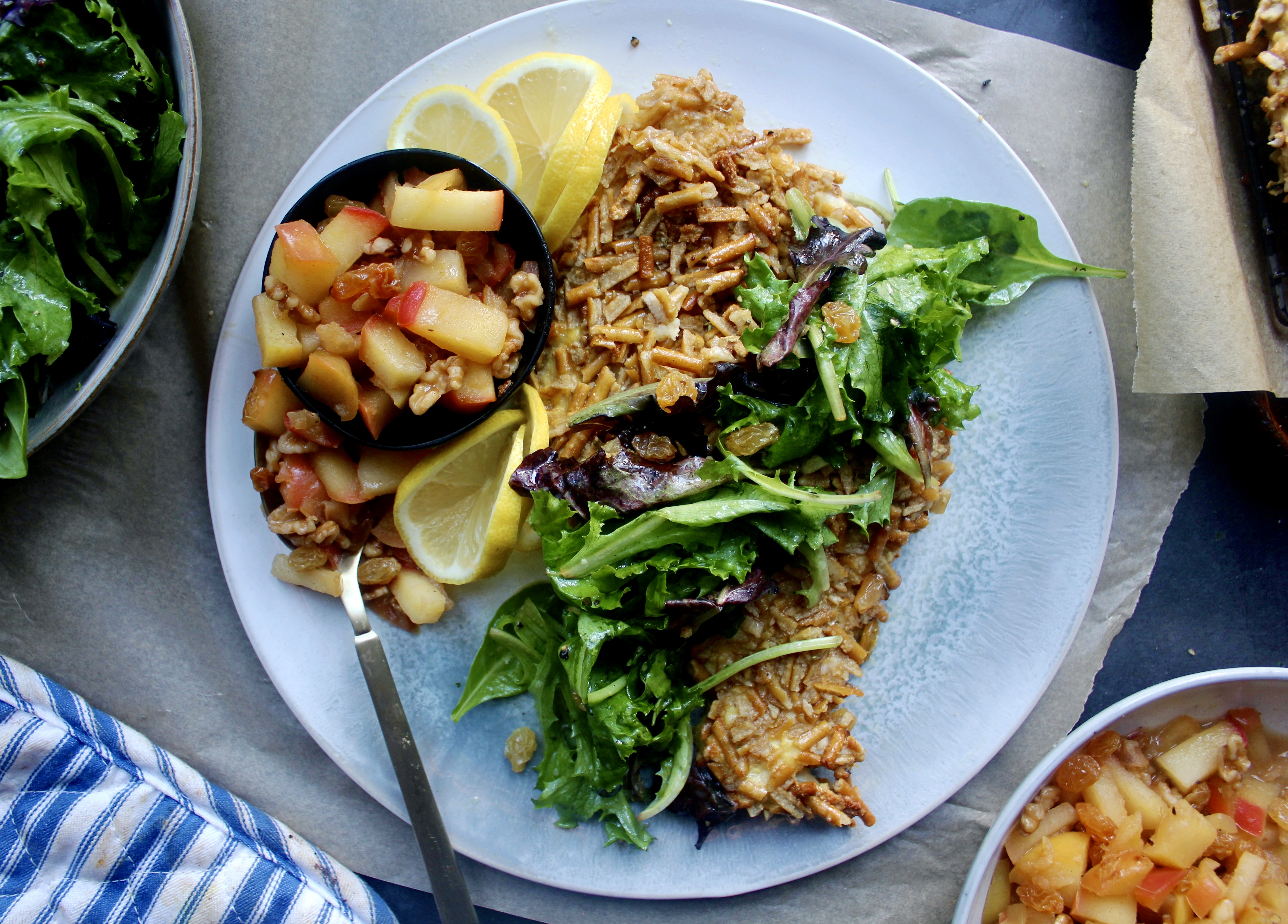 Crispy pretzel coated chicken paillard topped with lemony mixed greens and a sweet and tangy apple chutney: this Apple Chutney Pretzel Crusted Chicken is an all time favorite dinner!