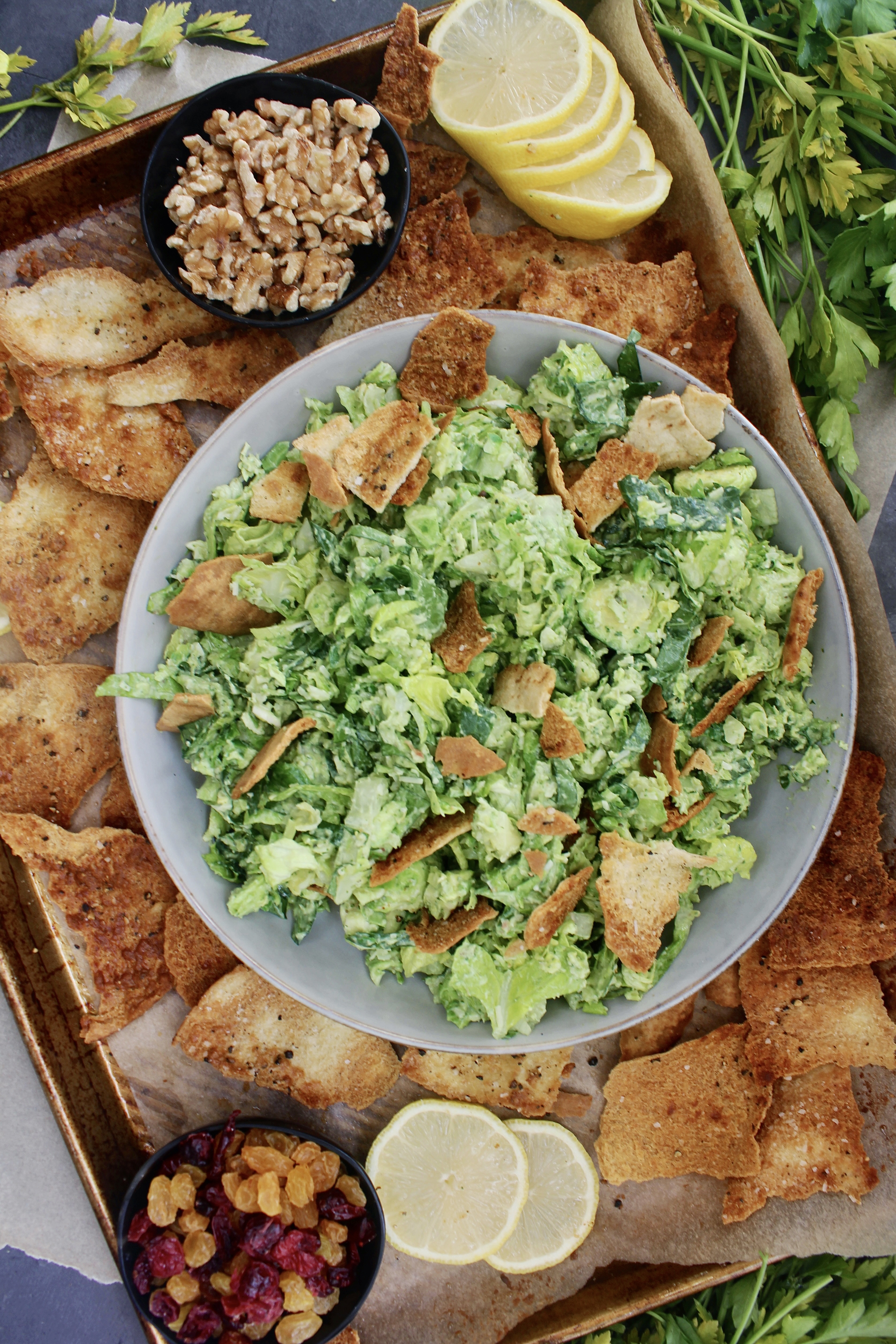 Warm and crispy homemade pita chips chopped up with shredded brussels, kale, some parm, and the creamiest dreamiest avocado dressing: this Avocado Brussels Sprouts Chop with Homemade Pita Chips has to be on this week’s menu!!