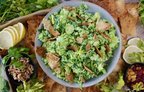 Warm and crispy homemade pita chips chopped up with shredded brussels, kale, some parm, and the creamiest dreamiest avocado dressing: this Avocado Brussels Sprouts Chop with Homemade Pita Chips has to be on this week’s menu!!