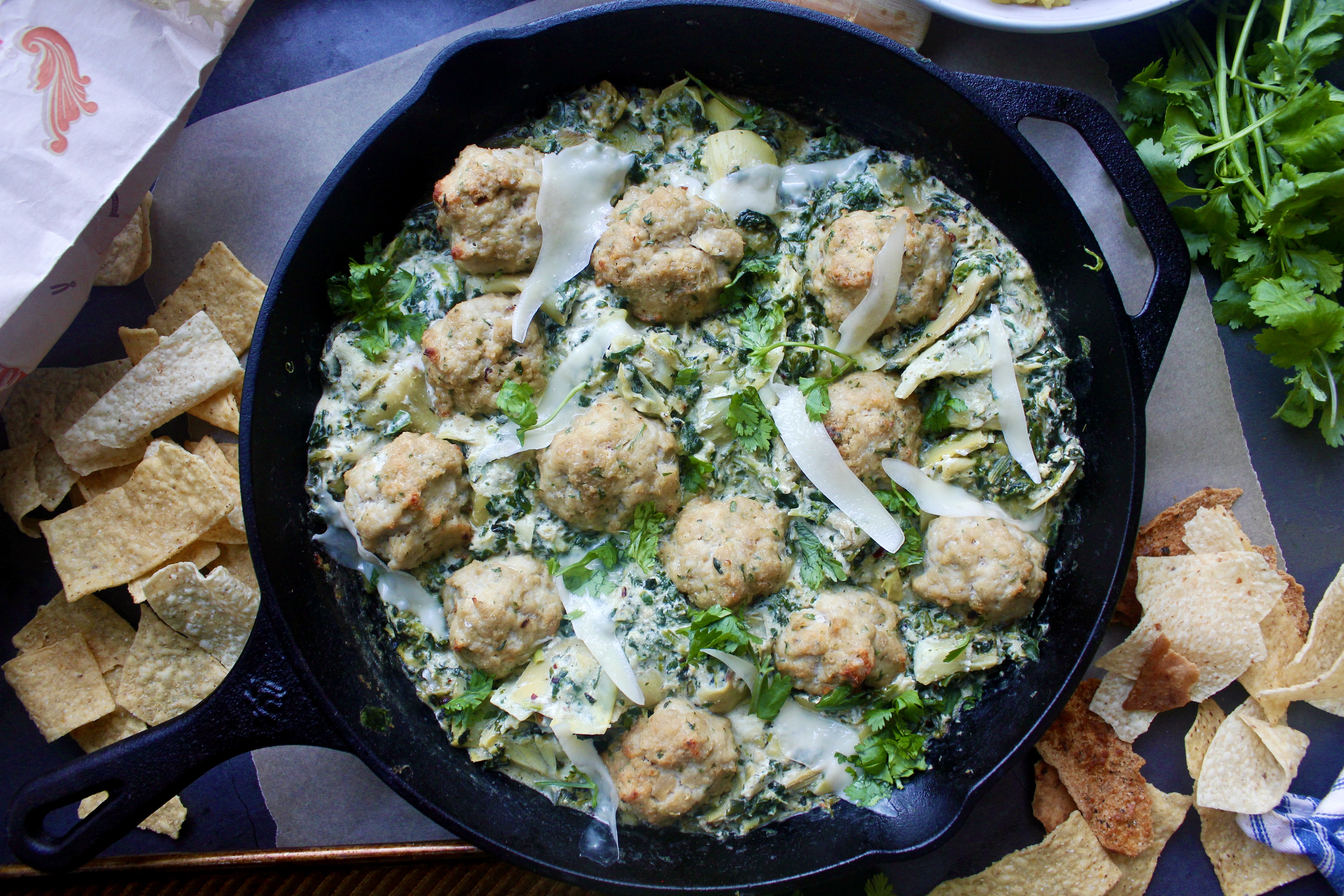 The creamy, cheesy spinach and artichoke dip we all know and love lightened up and served over a bed of yellow rice with ALL the crispy chips: these Healthier Spinach and Artichoke Chicken Meatballs are truly the coziest, easy dinner.