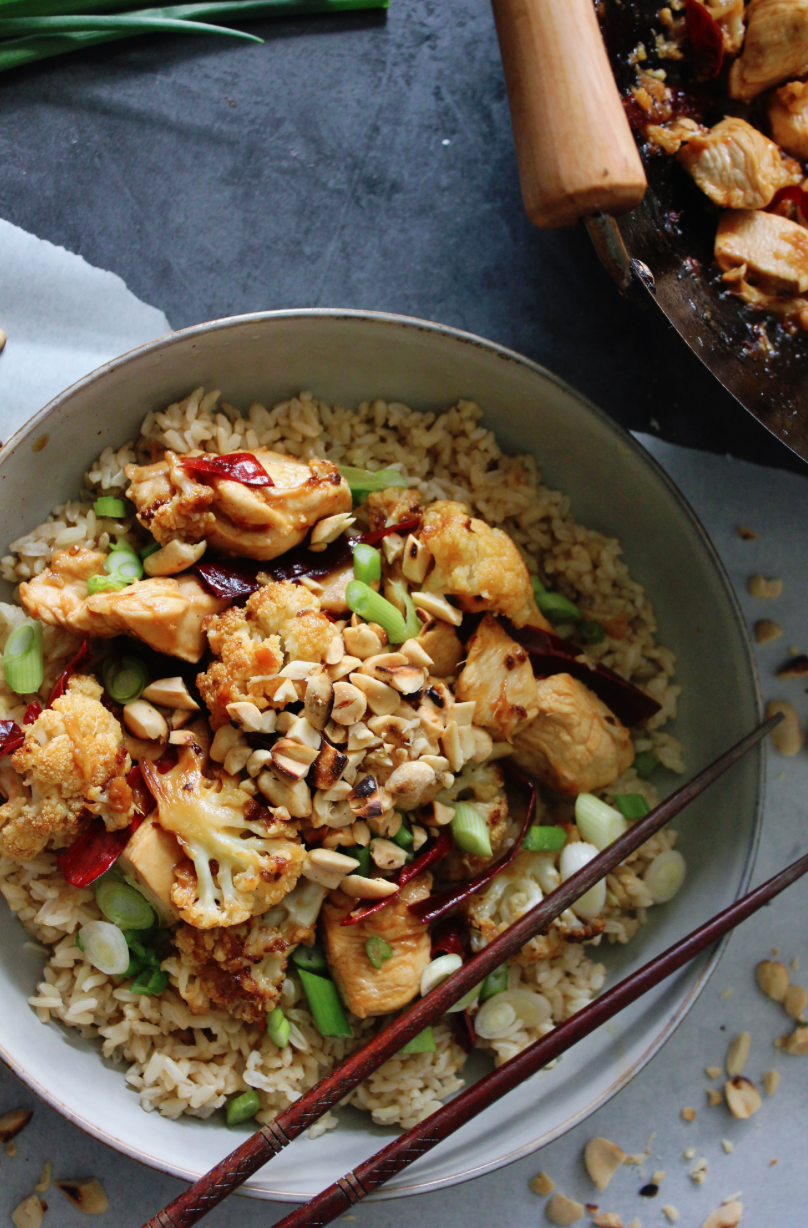 Oven roasted crispy cauliflower and perfectly seared chicken tossed in a sweet and spicy kung pao sauce and topped with toasted peanuts and scallions… this Crispy Kung Pao Chicken and Cauliflower is a super simple dinner that’s honestly better than takeout!