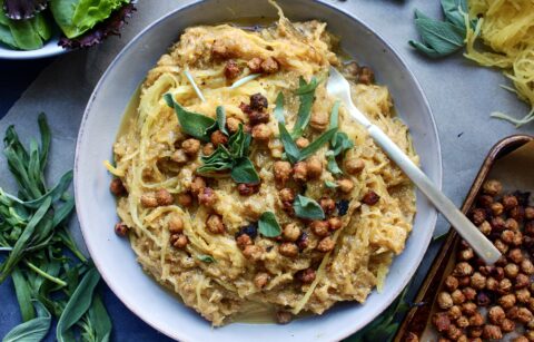 A creamy, lighter pumpkin vodka sauce tossed with perfectly roasted spaghetti squash topped with crispy chickpeas, all the herbs, and of course tons of ricotta: I could seriously eat this Pumpkin Ricotta Spaghetti Squash with Crispy Chickpeas every night of the week.