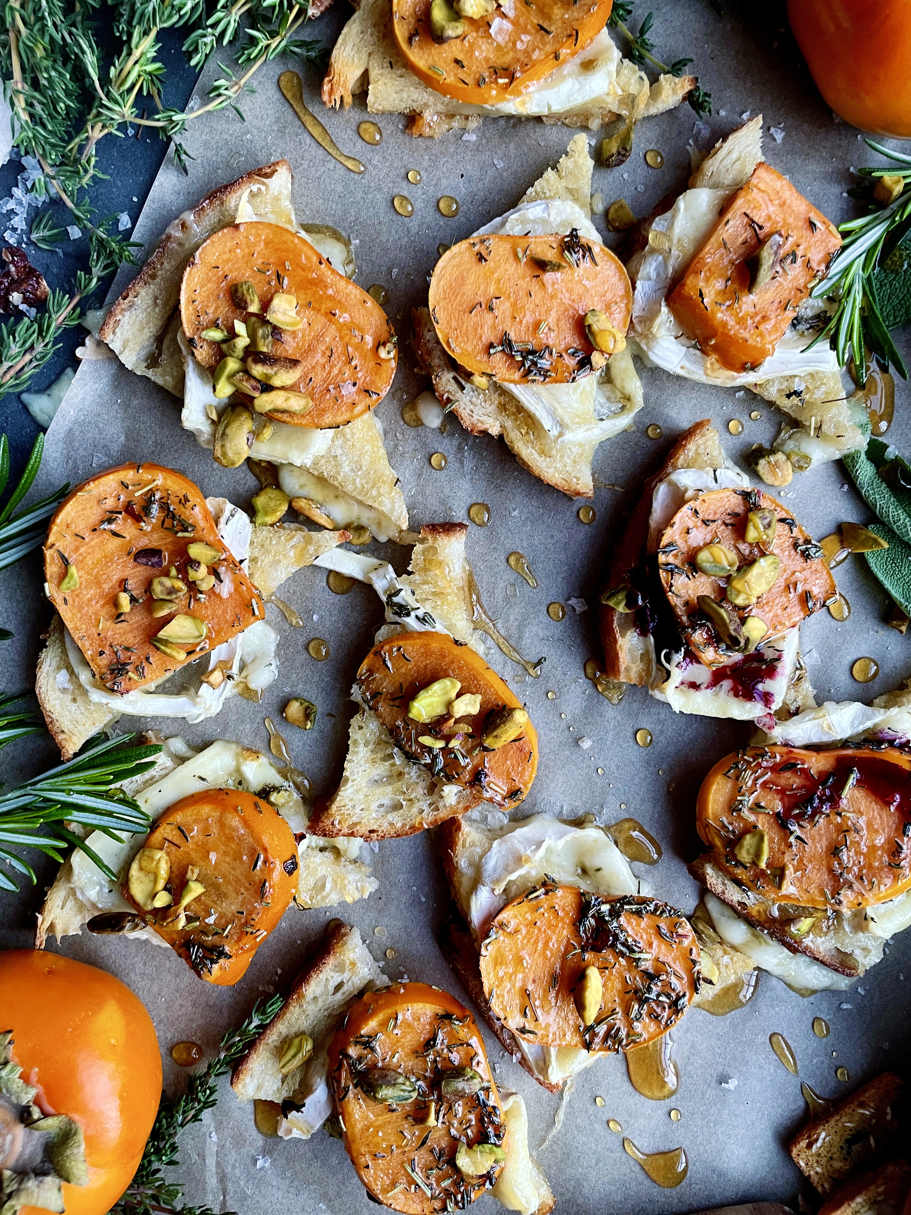 Golden, crispy sourdough toast topped with melty brie and quick marinated persimmons: these Baked Brie Persimmon Tartines are my favorite fall appetizer.