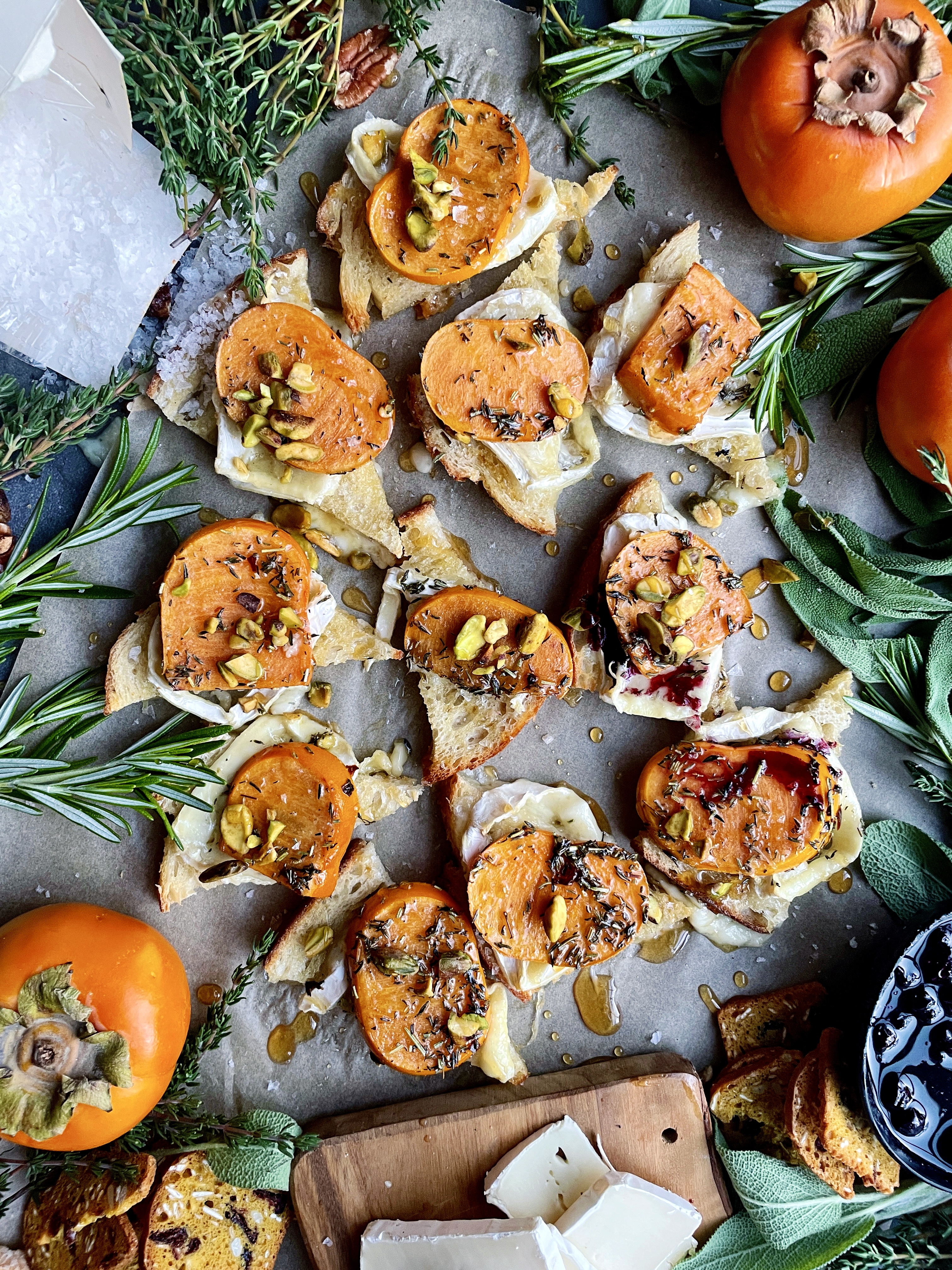 Golden, crispy sourdough toast topped with melty brie and quick marinated persimmons: these Baked Brie Persimmon Tartines are my favorite fall appetizer.