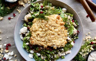 A dijon hummus and macadamia nut crusted salmon over a pomegranate feta pearled couscous salad: these Hummus Macadamia Crusted Salmon Couscous Bowls are one of my favorite healthy fall recipes!