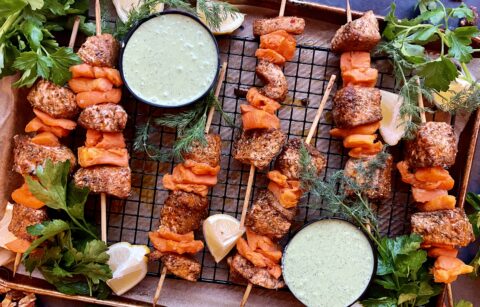 Crispy baked salmon layered with smashed sweet potato cubes and finished off with a lemony parsley dill yogurt: these Smashed Sweet Potato Salmon Skewers with Parsley Dill Sauce are an all time favorite recipe!