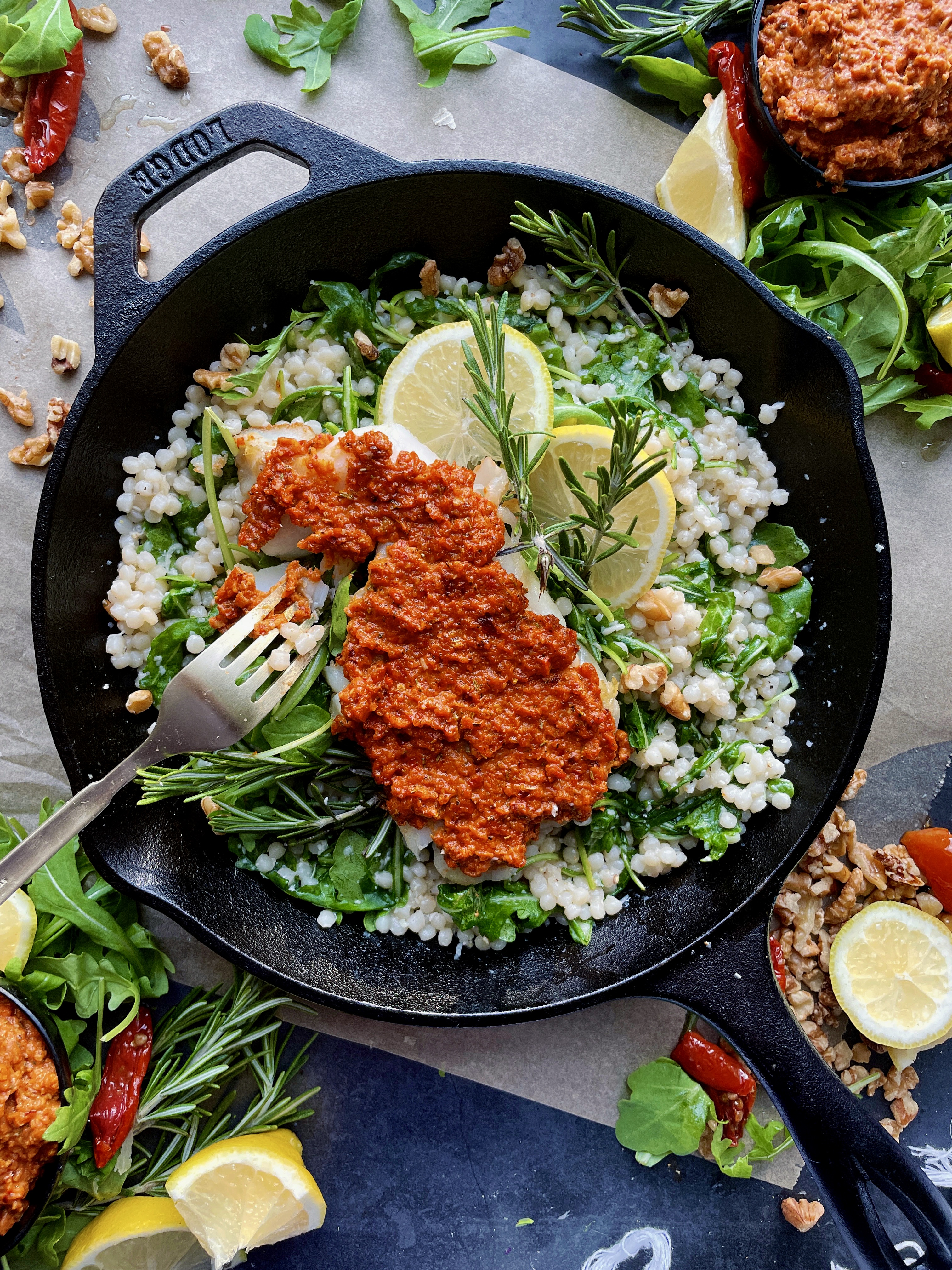 The easiest tangy spiced sun-dried tomato pesto spooned onto a crispy fillet of fish and served over a warm pearled couscous salad: this Crispy Sun-Dried Tomato Cod Over Lemony Couscous is one of my favorite fish recipes out there!