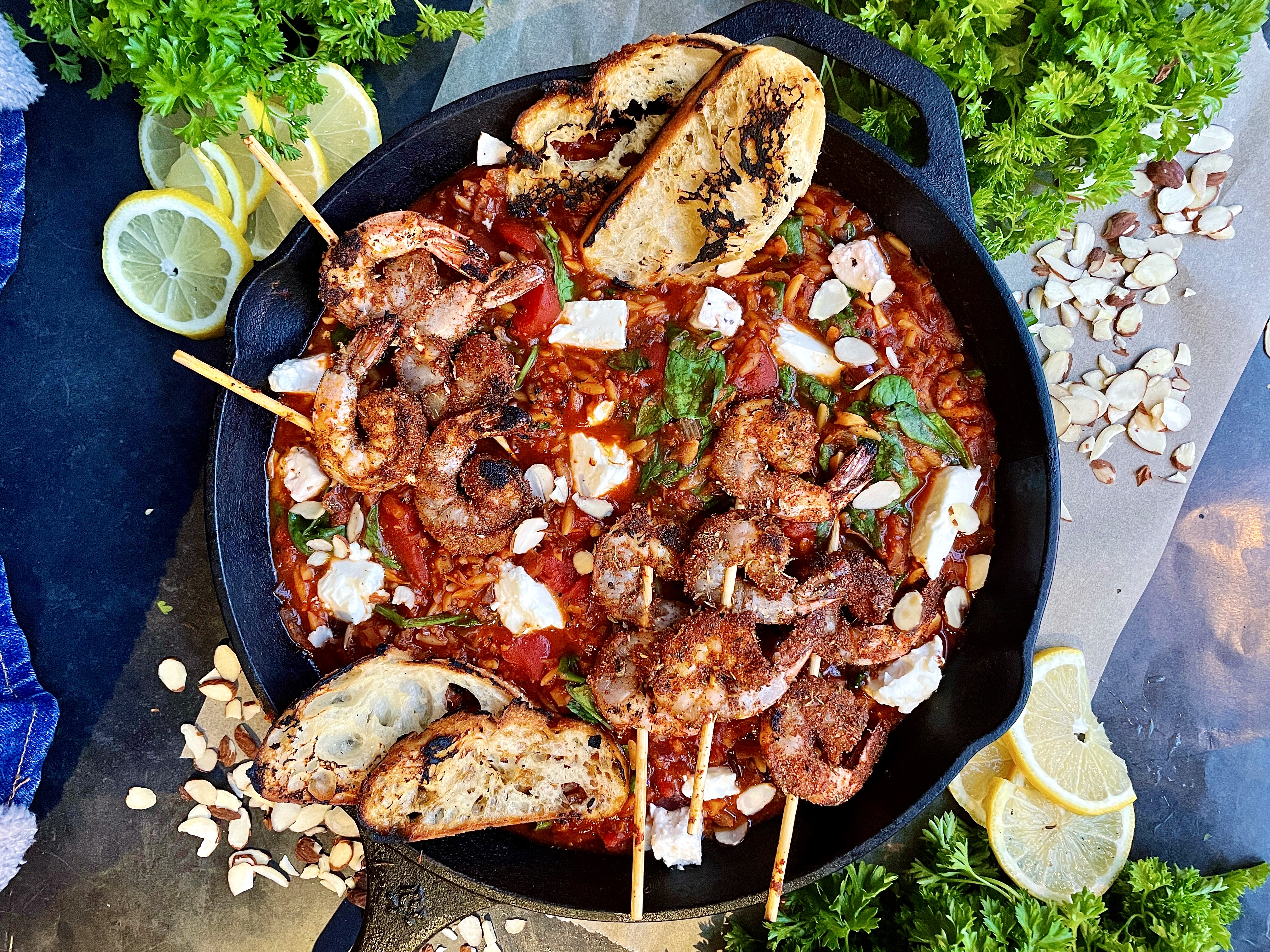 Crispy blackened shrimp, extra garlicky caramelized onion, and creamy feta-y orzo all melted down in a white wine tomato sauce: this Greek Blackened Shrimp Orzo Skillet is an all time favorite fresh meal!