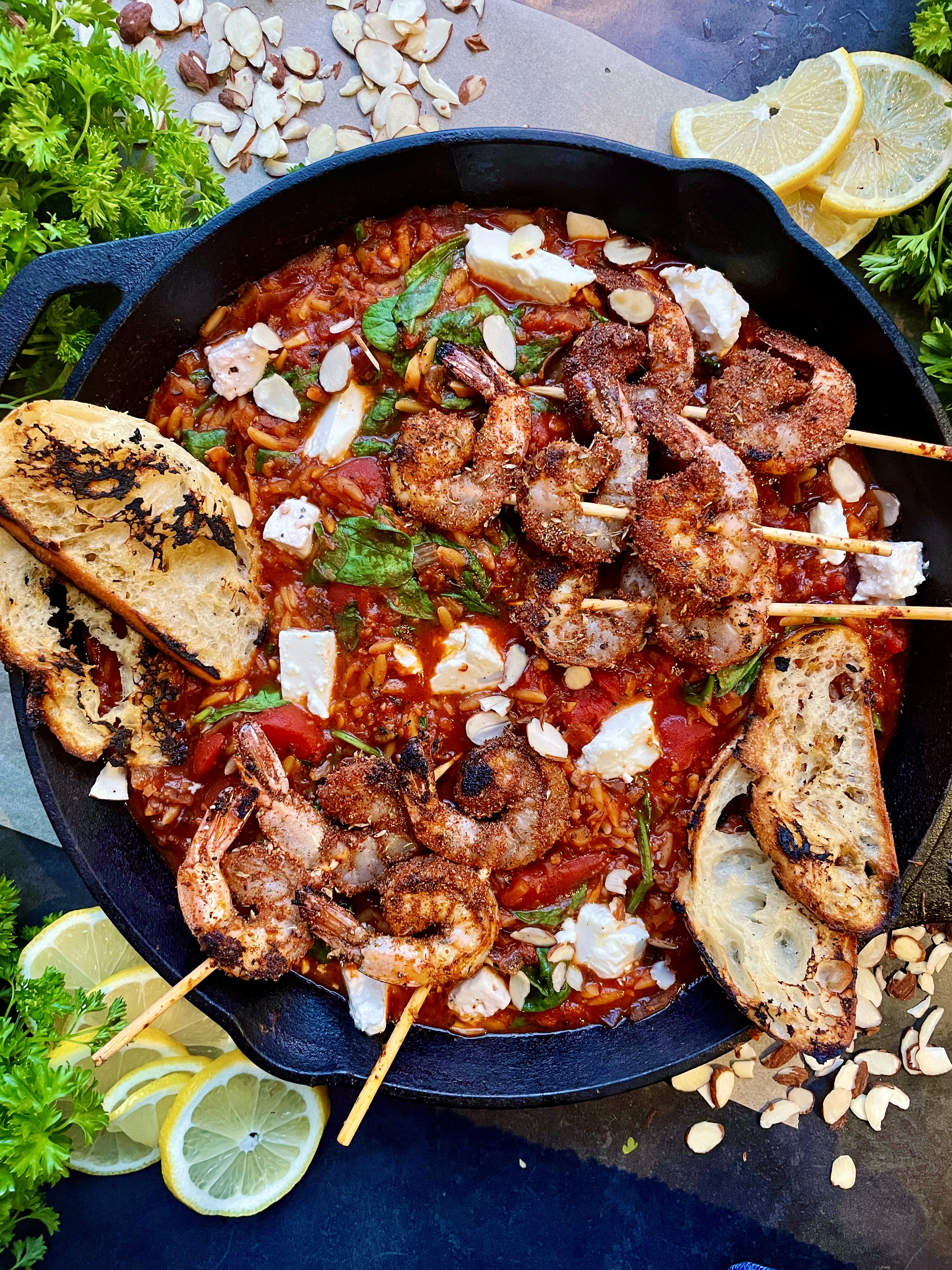 Crispy blackened shrimp, extra garlicky caramelized onion, and creamy feta-y orzo all melted down in a white wine tomato sauce: this Greek Blackened Shrimp Orzo Skillet is an all time favorite fresh meal!