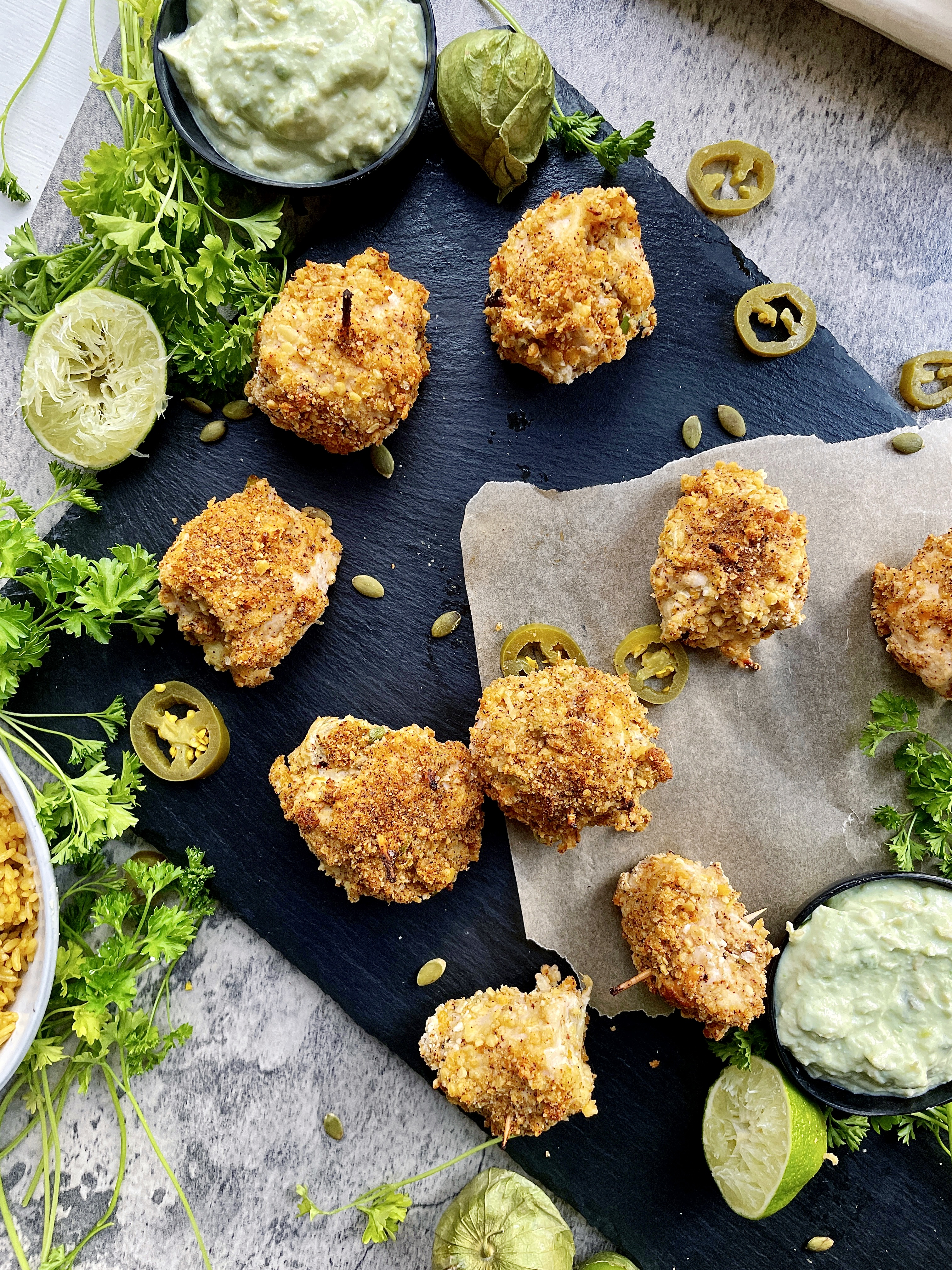 A tangy, spicy, and oh-so creamy green chili filling tucked inside crispy chicken and baked to golden brown: these Healthier Crispy Chiles Chicken Roll Ups are truly too good to be true.