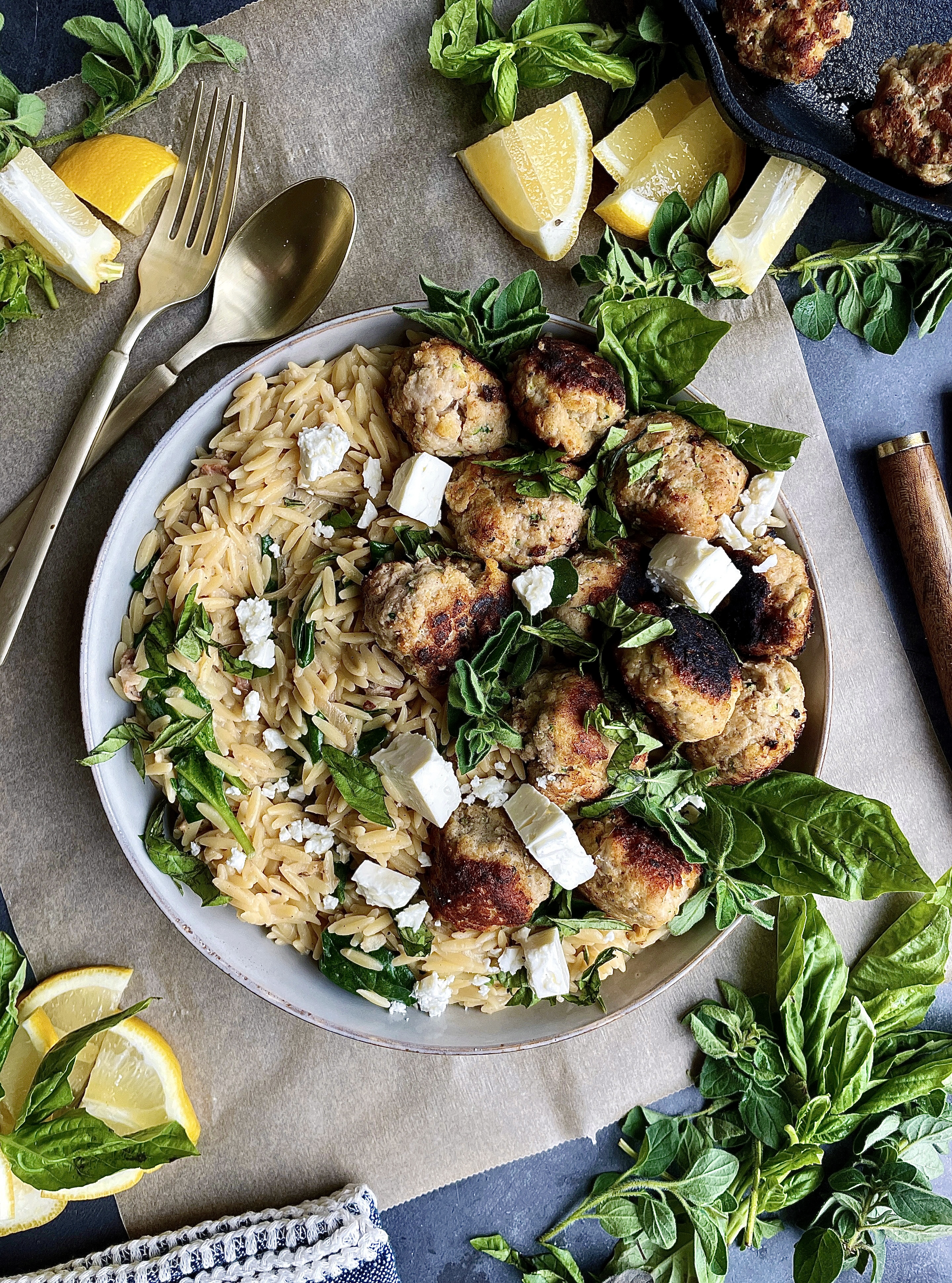 Crispy seared meatballs tucked into a creamy orzo skillet with some salty pancetta, all the lemon, and a whole lotta parm: this Cheesy Lemon Orzo Meatball Skillet is truly the dinner we all need right now.