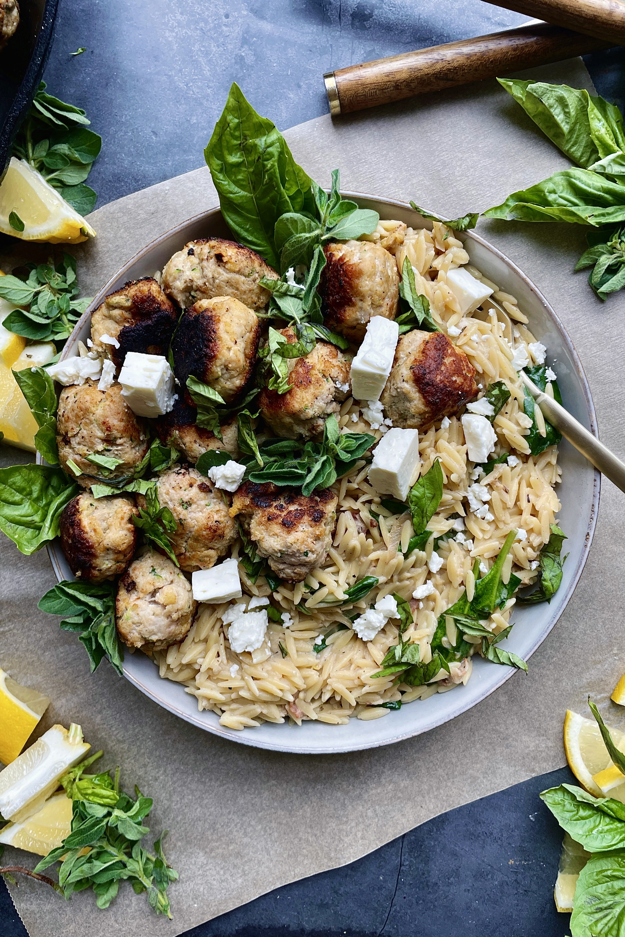 Crispy seared meatballs tucked into a creamy orzo skillet with some salty pancetta, all the lemon, and a whole lotta parm: this Cheesy Lemon Orzo Meatball Skillet is truly the dinner we all need right now.